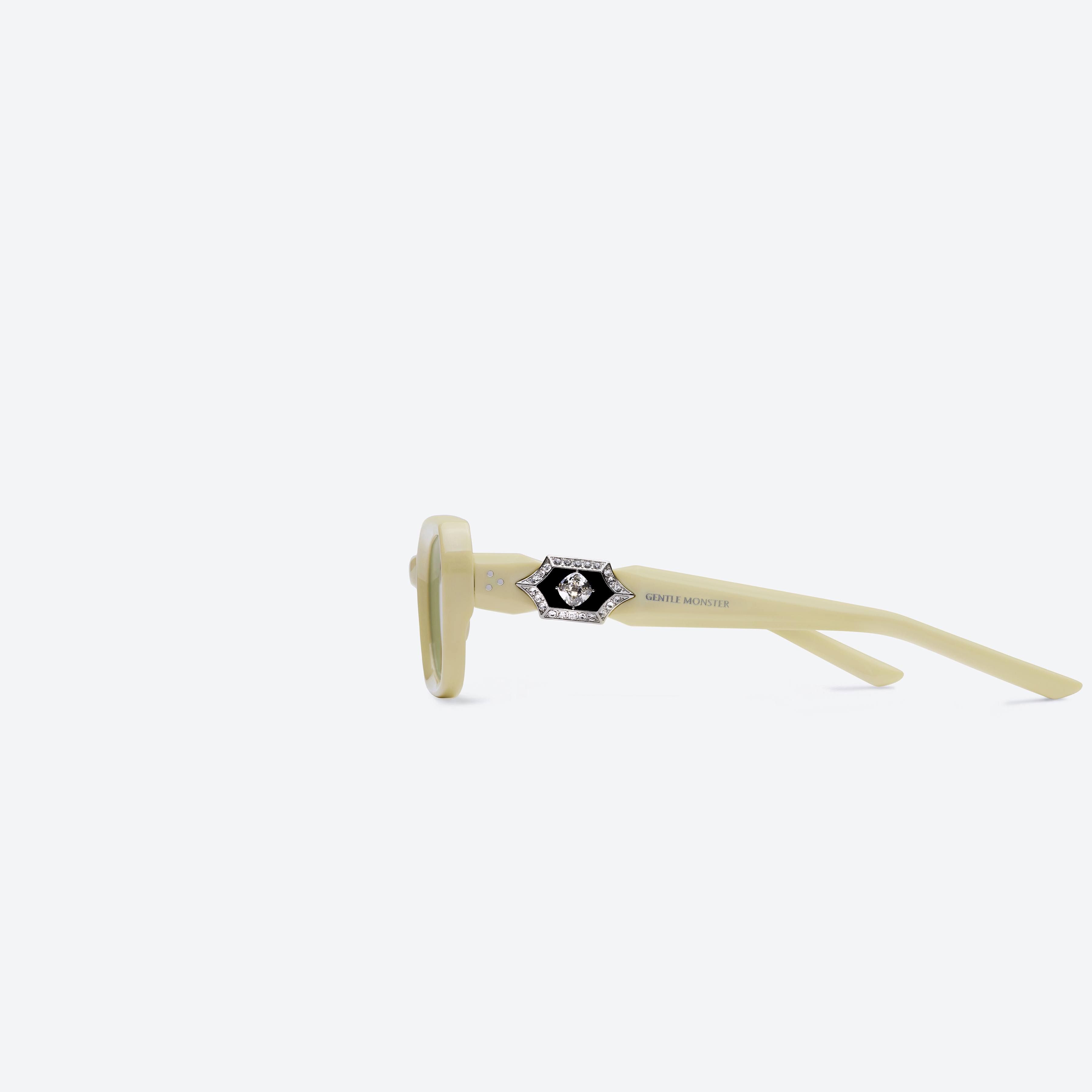 A detailed left view of Gentle Monster Phantom Y5 Yellow Acetate framed Square sunglasses.