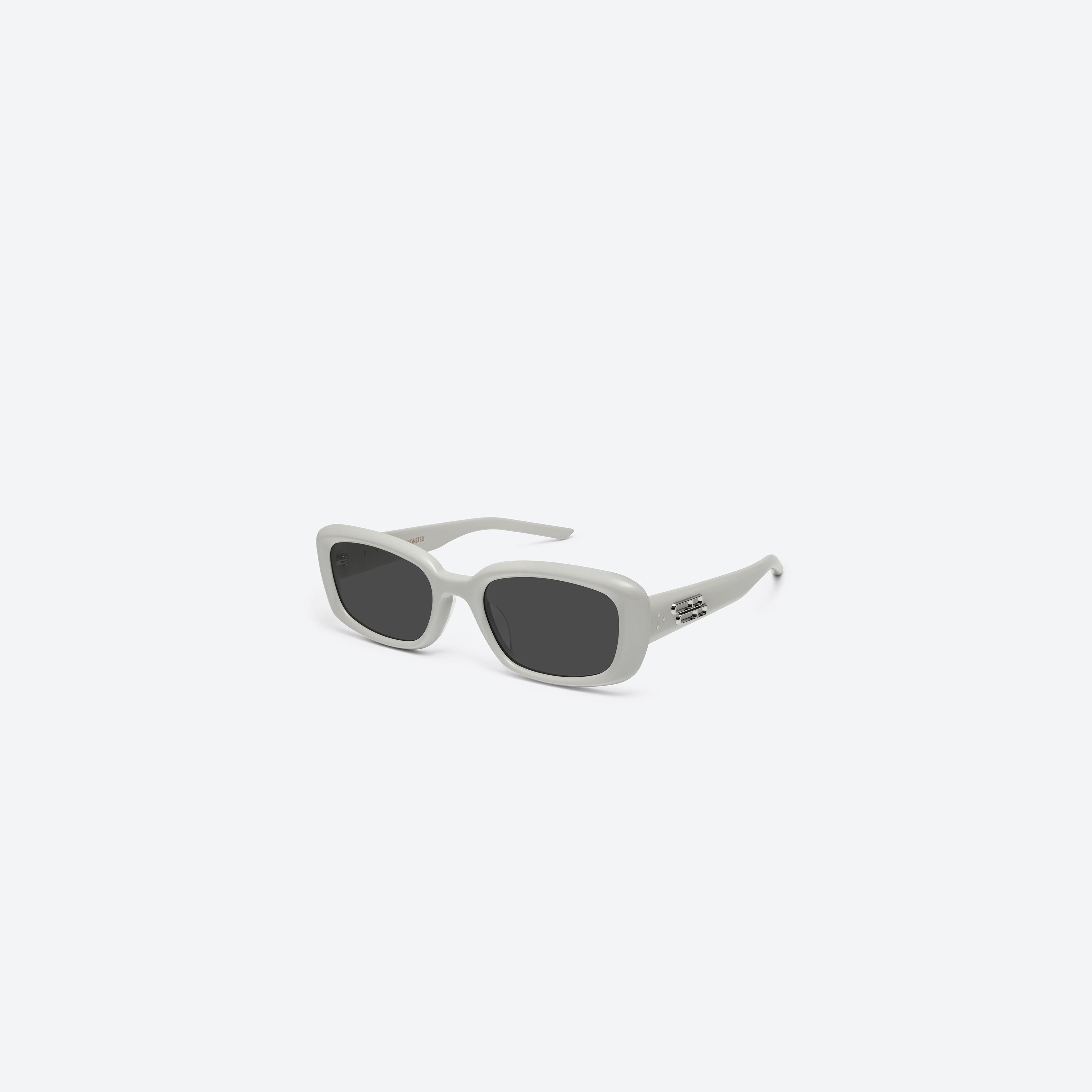 45-degree view of Gentle Monster Lin G12 Gray Acetate framed Square sunglasses.