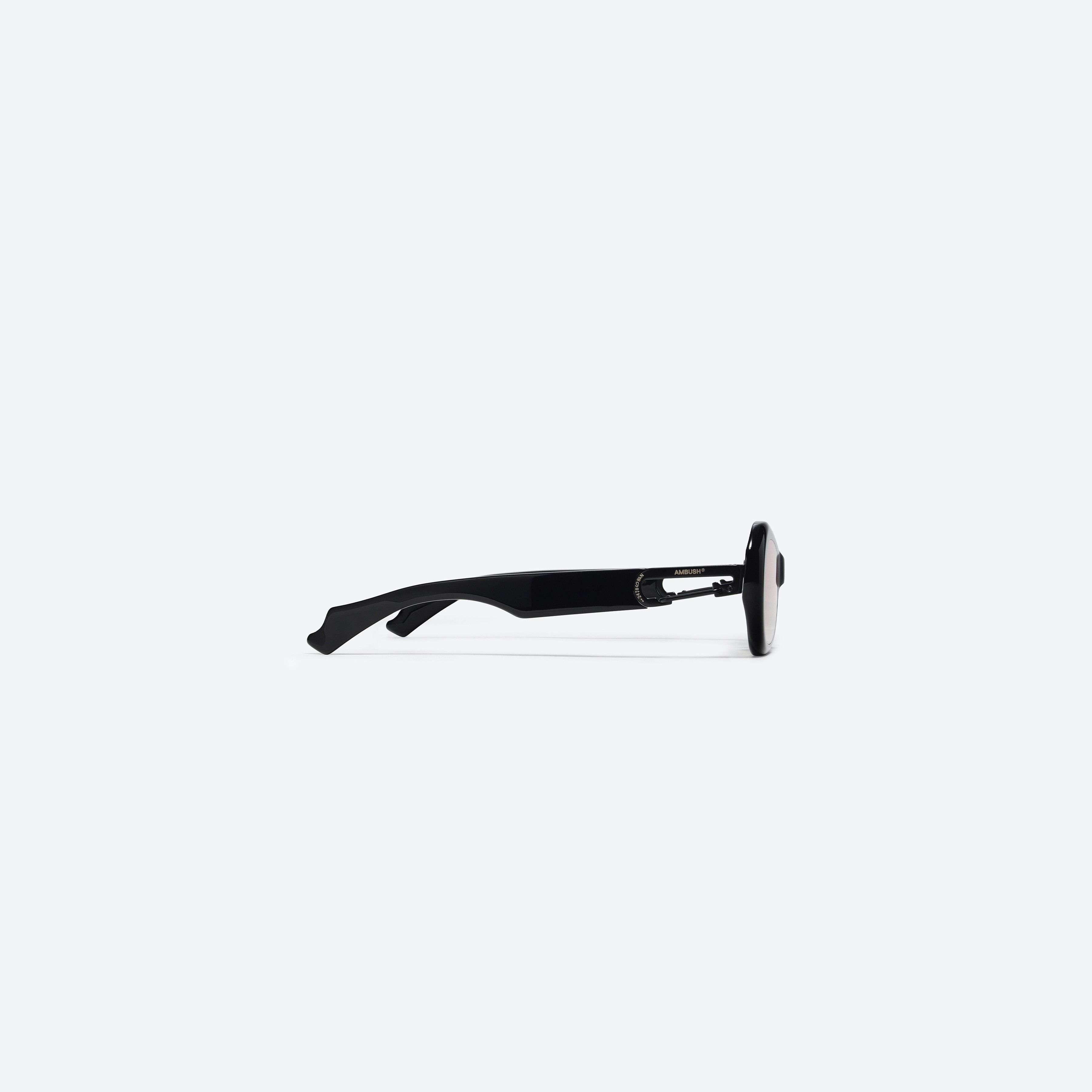 A detailed right view of Gentle Monster Ambush - Carabiner 2 01(OR) Black Mixed framed Cat-eye sunglasses.