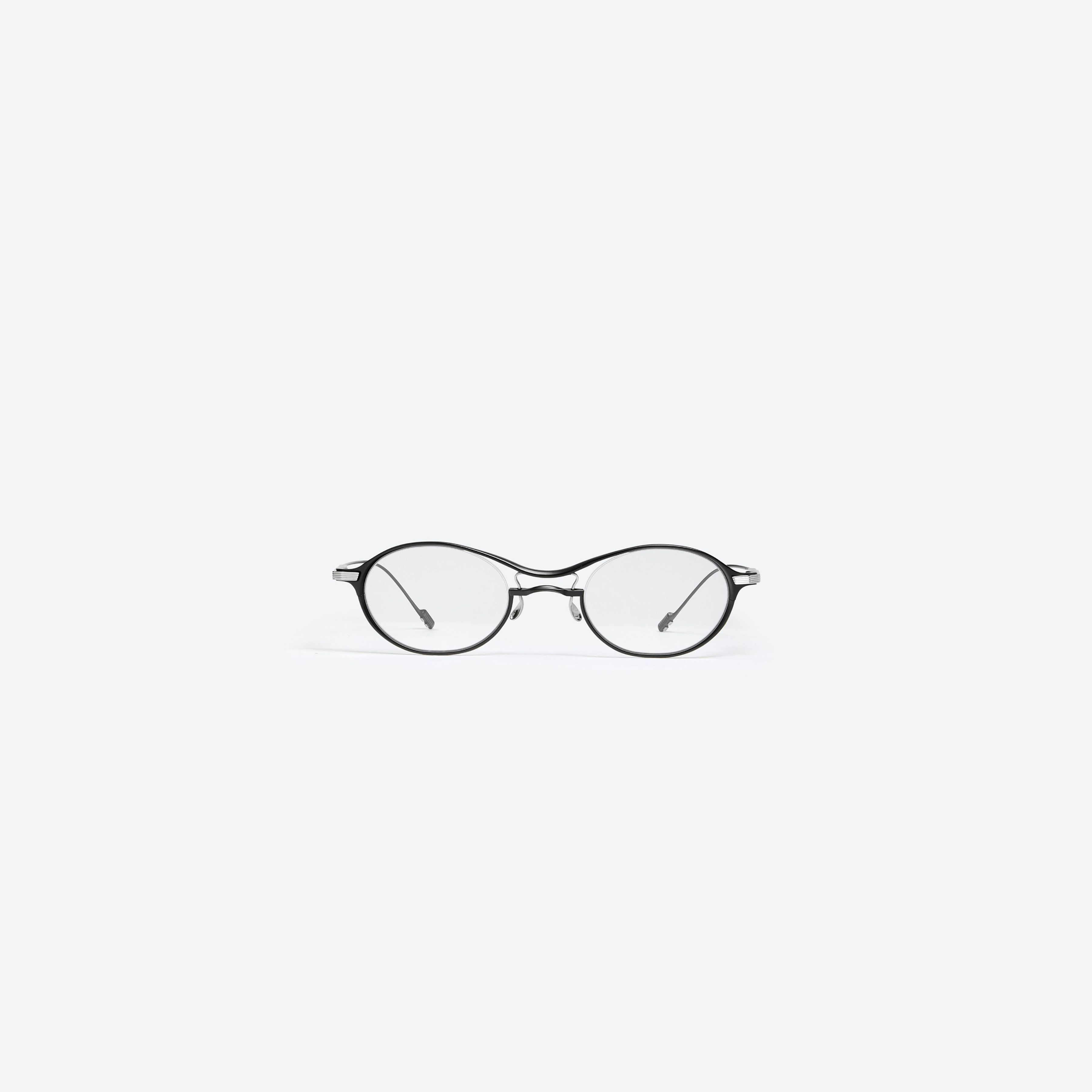 A front view of Gentle Monster Zitter M01 Black Metal framed Oval glasses.