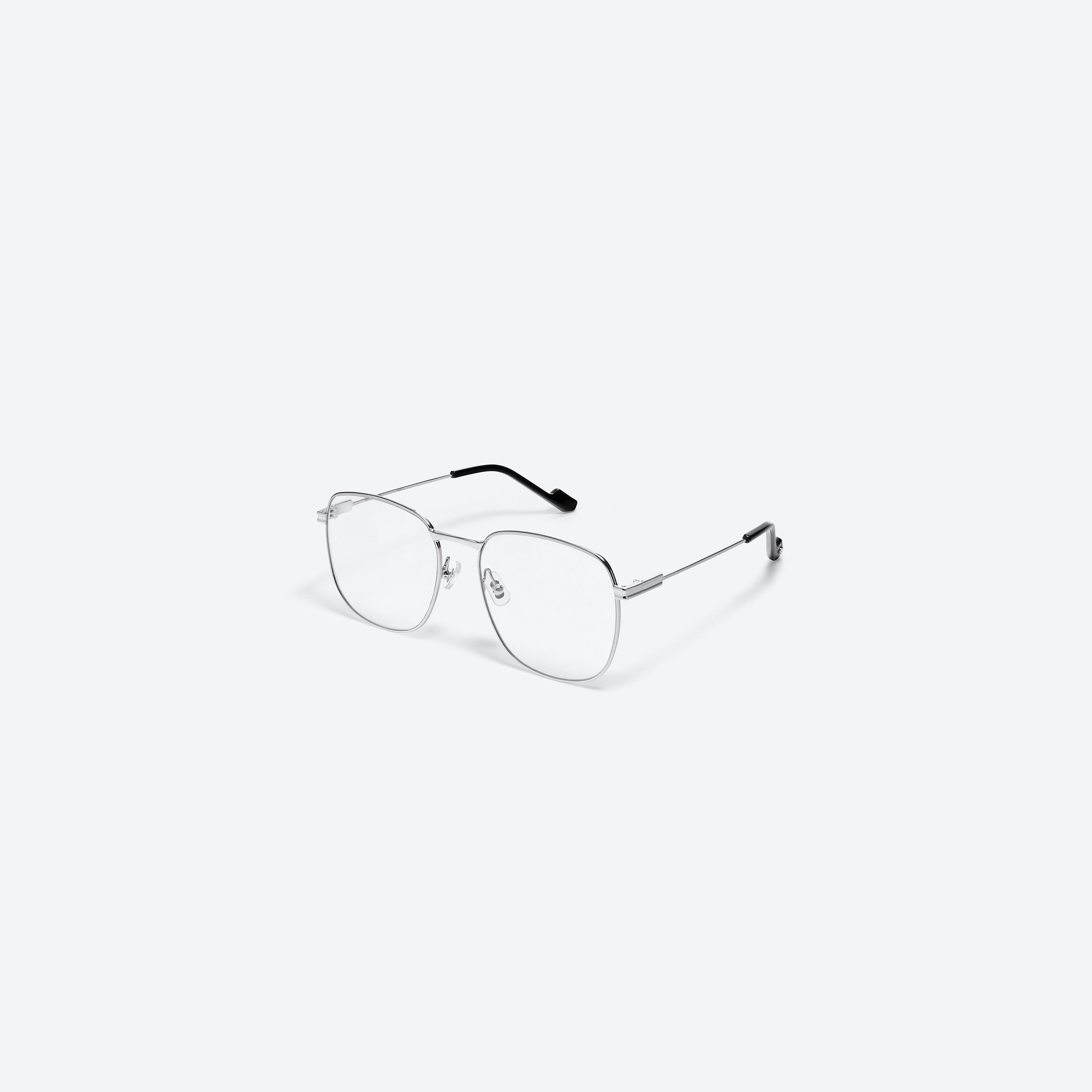 45-degree view of Gentle Monster Onil 02 Silver Metal framed Square glasses.