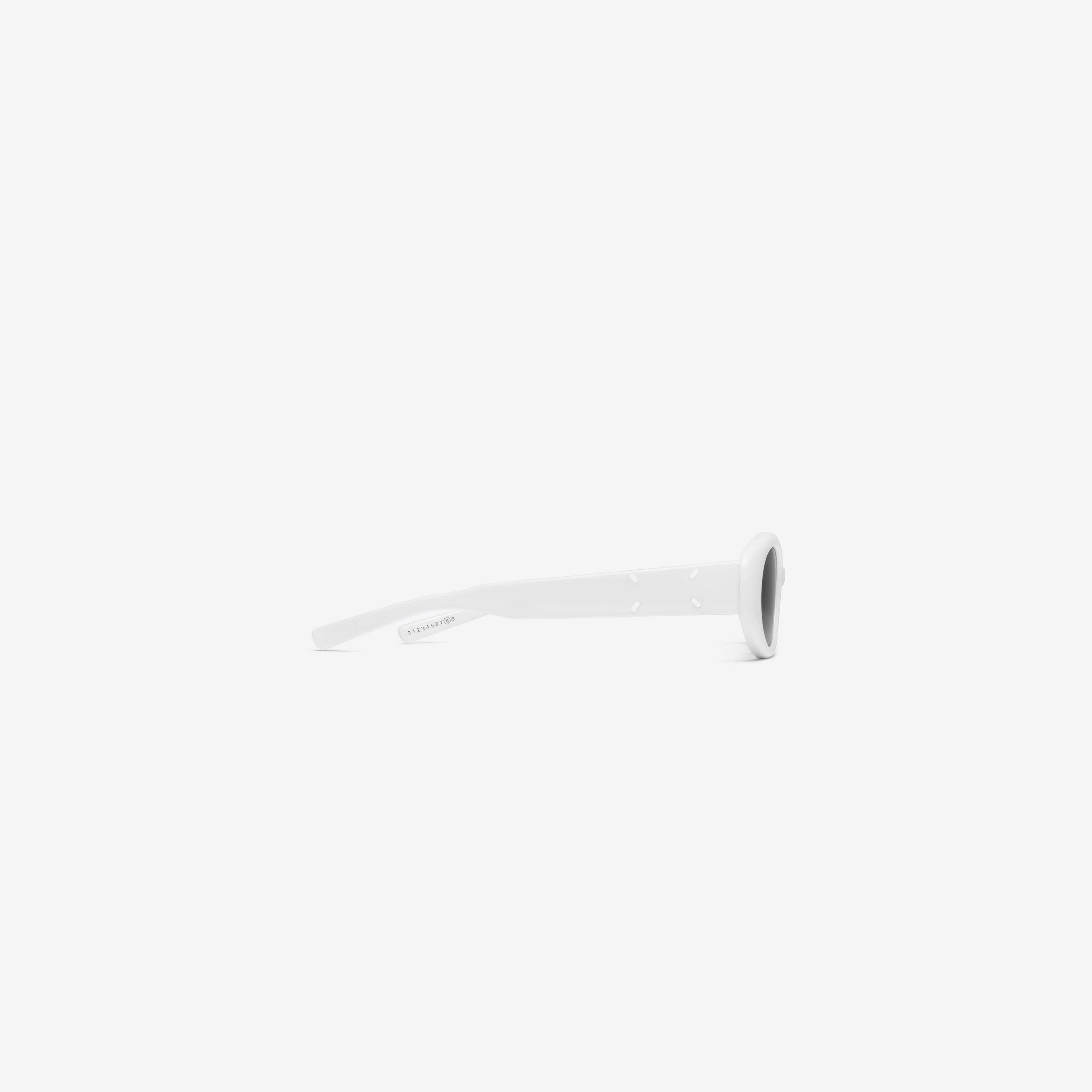 A detailed right view of Gentle Monster Maison Margiela - MM107 W2 White Acetate framed Oval sunglasses.