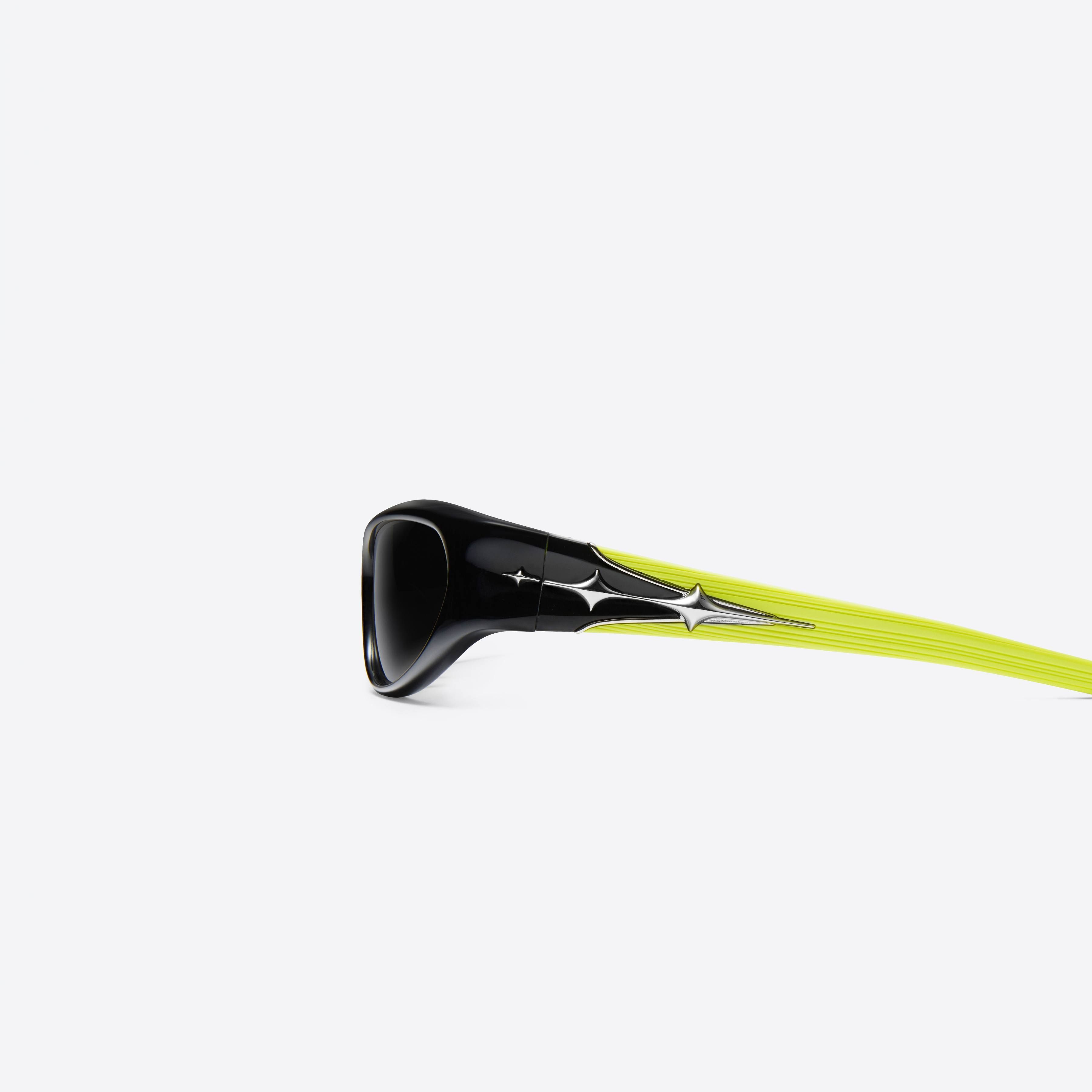 A detailed left view of Gentle Monster Limitless S01 Black Acetate framed Wraparound sunglasses.