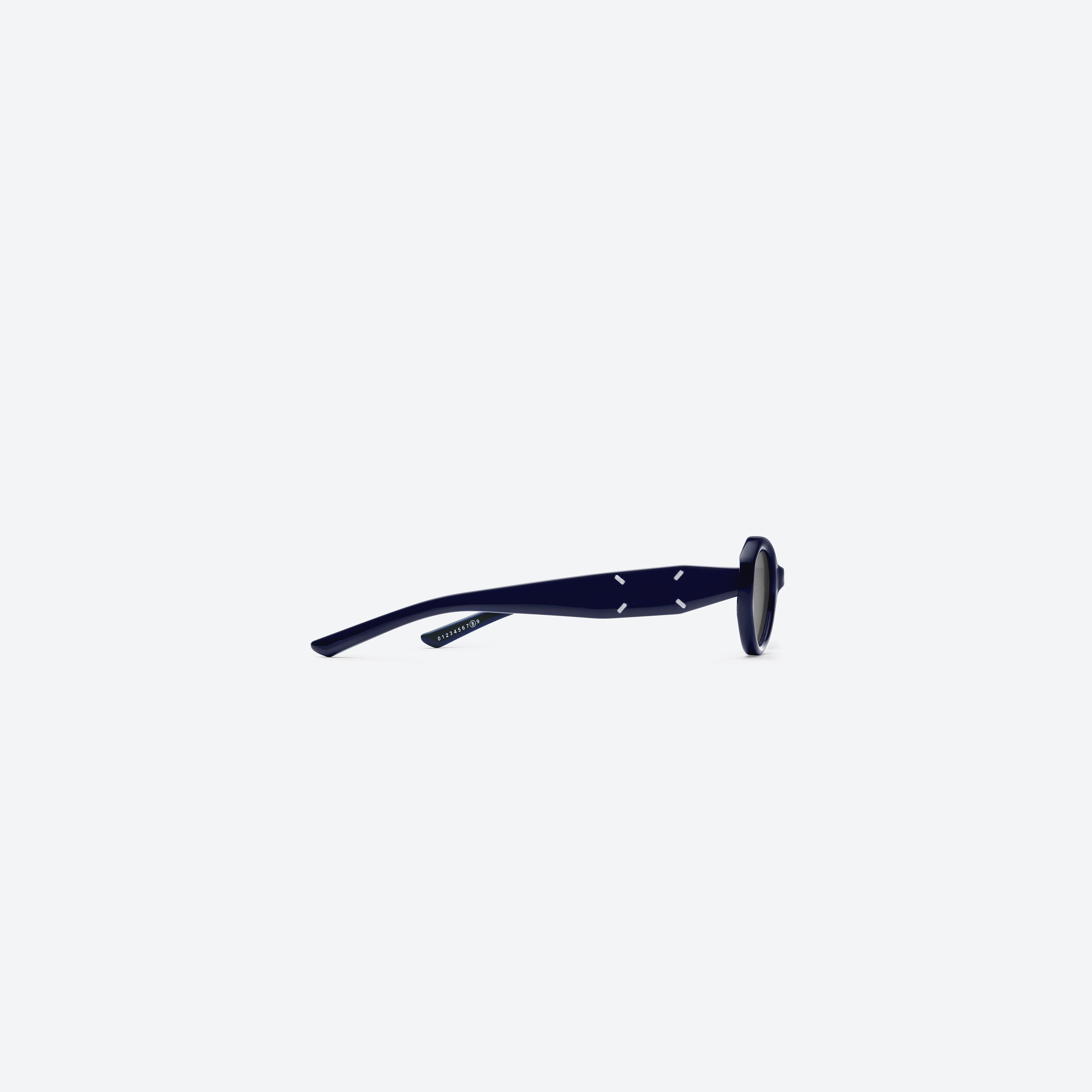 A detailed right view of Gentle Monster Maison Margiela - MM204 N6(G) Blue Acetate framed Oval sunglasses.