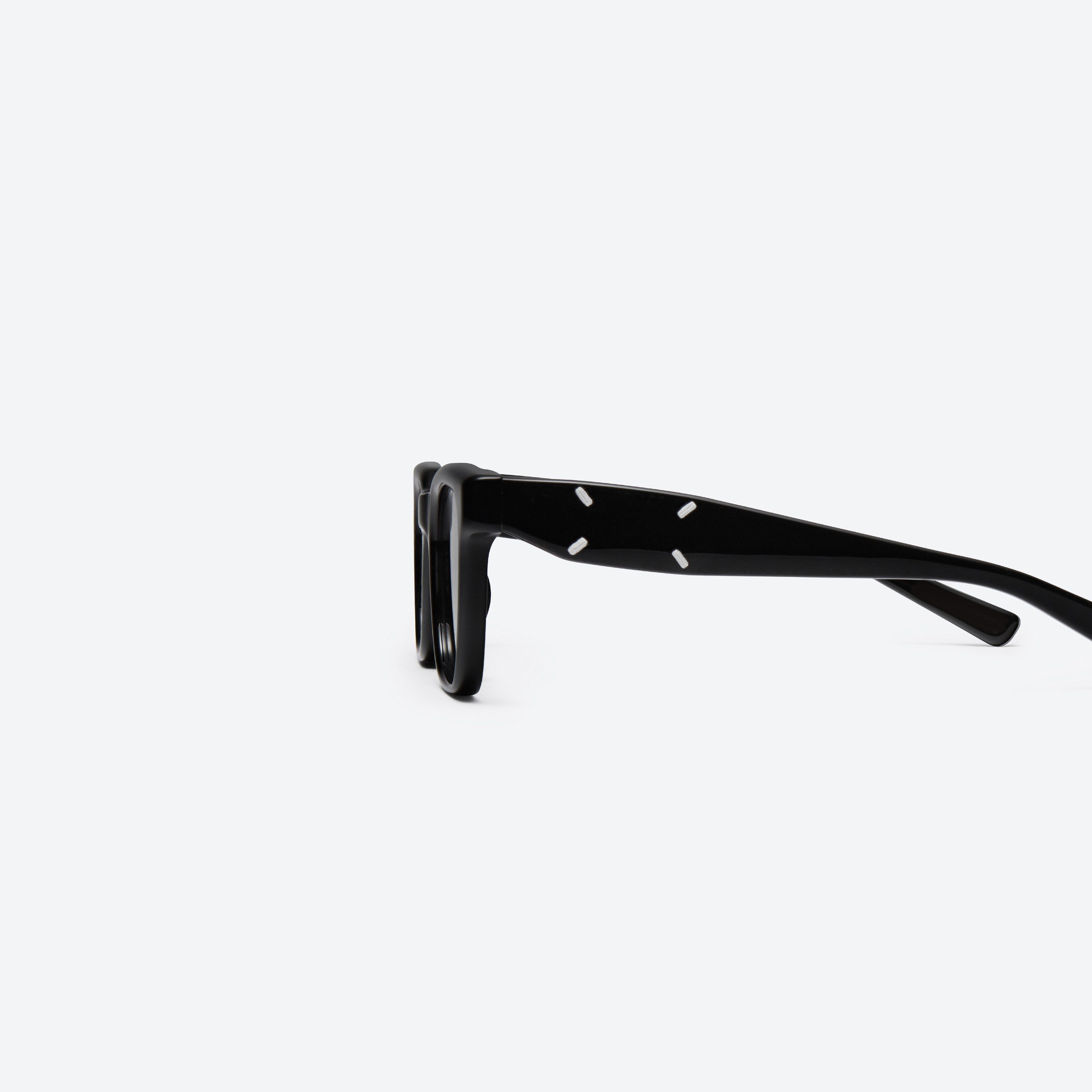 A detailed left view of Gentle Monster MM110 01 Black Acetate framed Square sunglasses.
