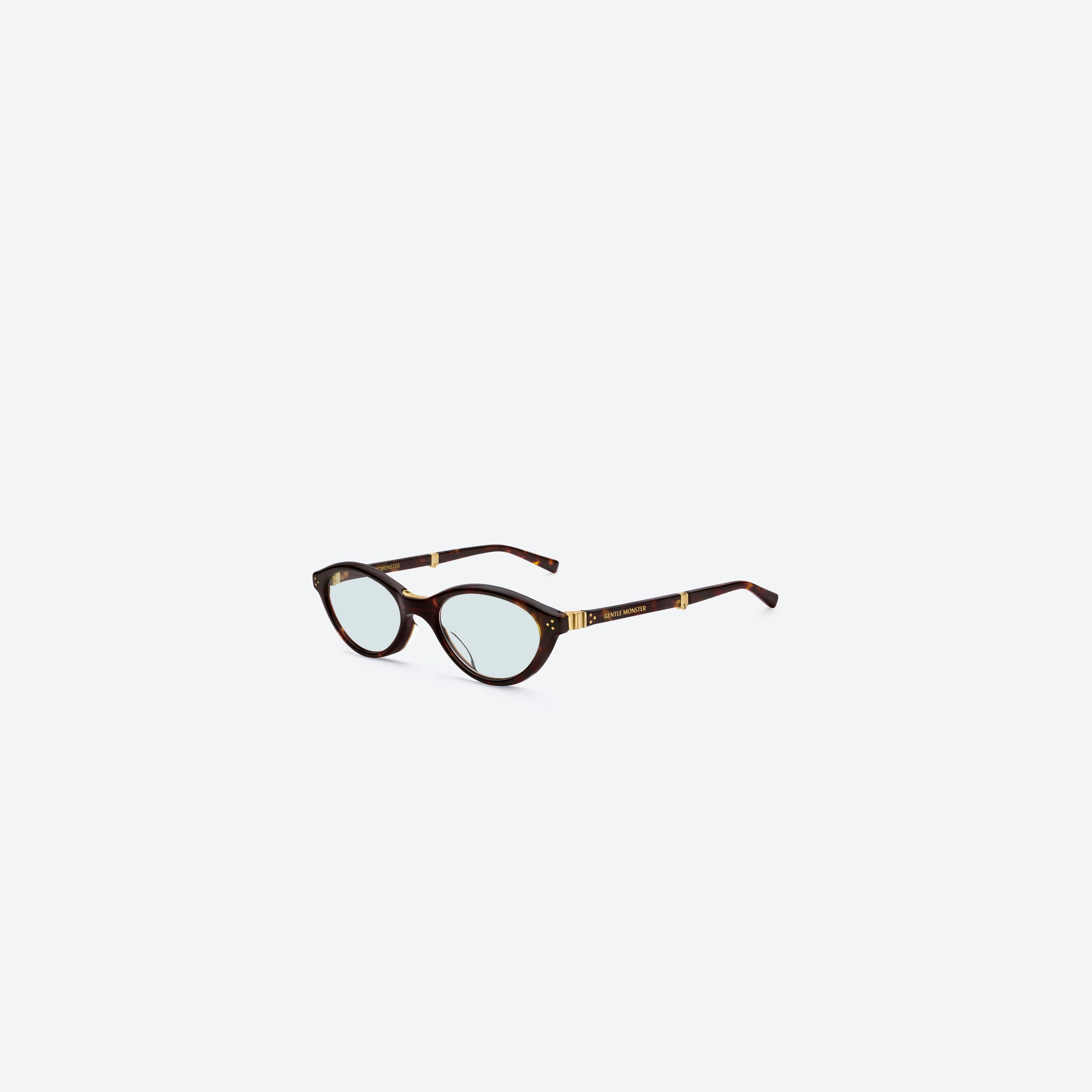 45-degree view of Gentle Monster TAKION T1 Tortoise Mixed framed Round glasses.