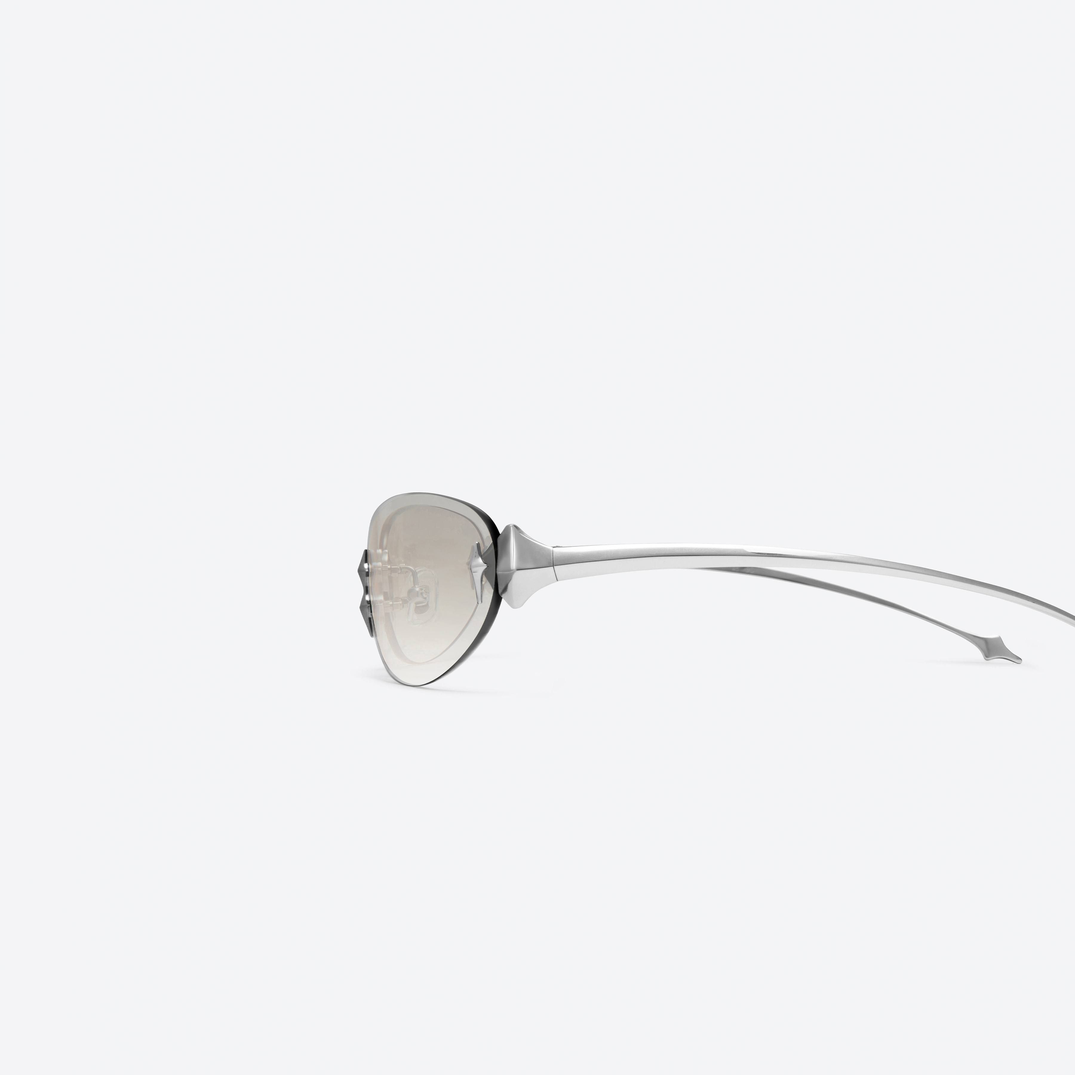 A detailed left view of Gentle Monster TTA 02(BRG) Silver Metal framed Oval sunglasses.