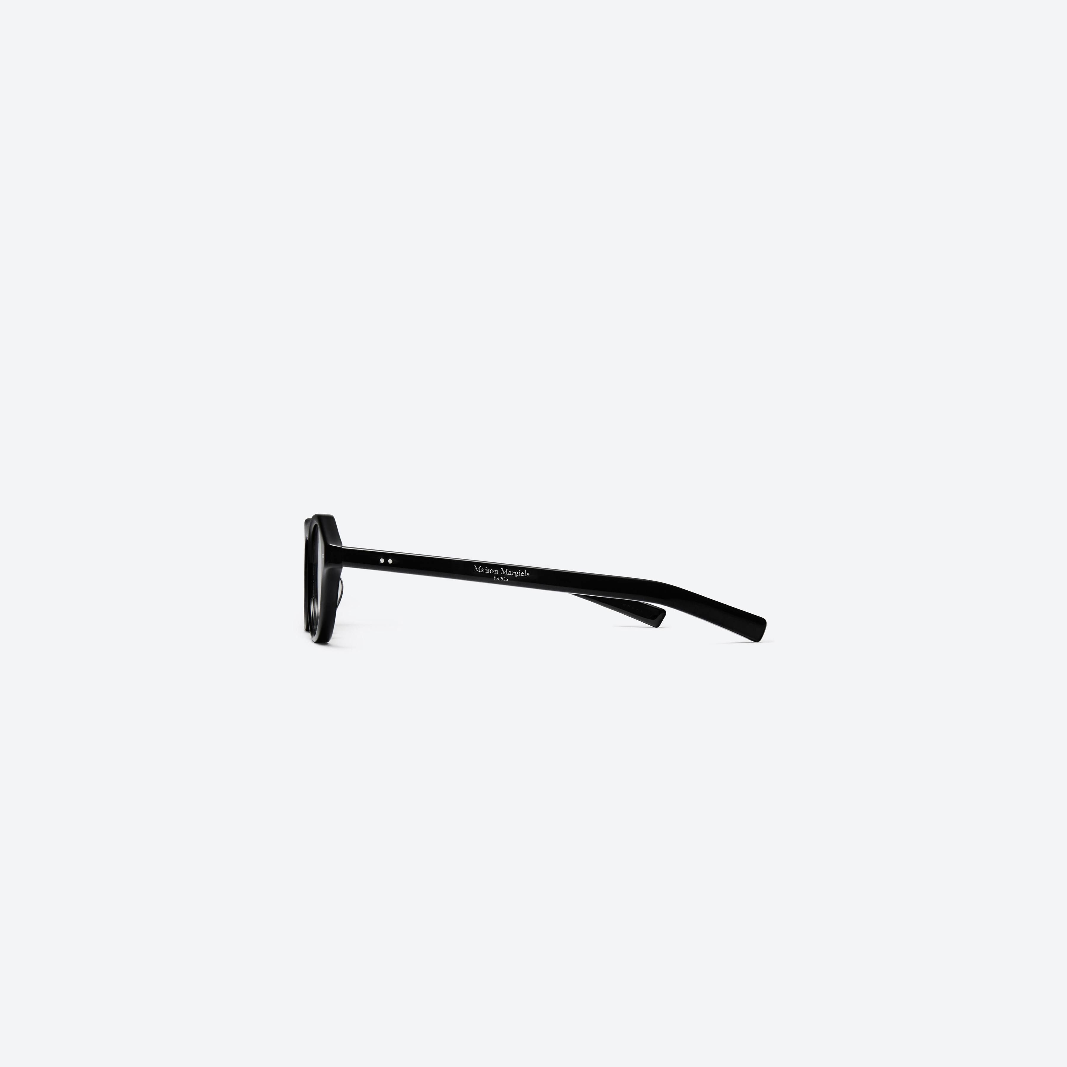A detailed right view of Gentle Monster Maison Margiela - MM112 01 Black Acetate framed Aviator glasses.