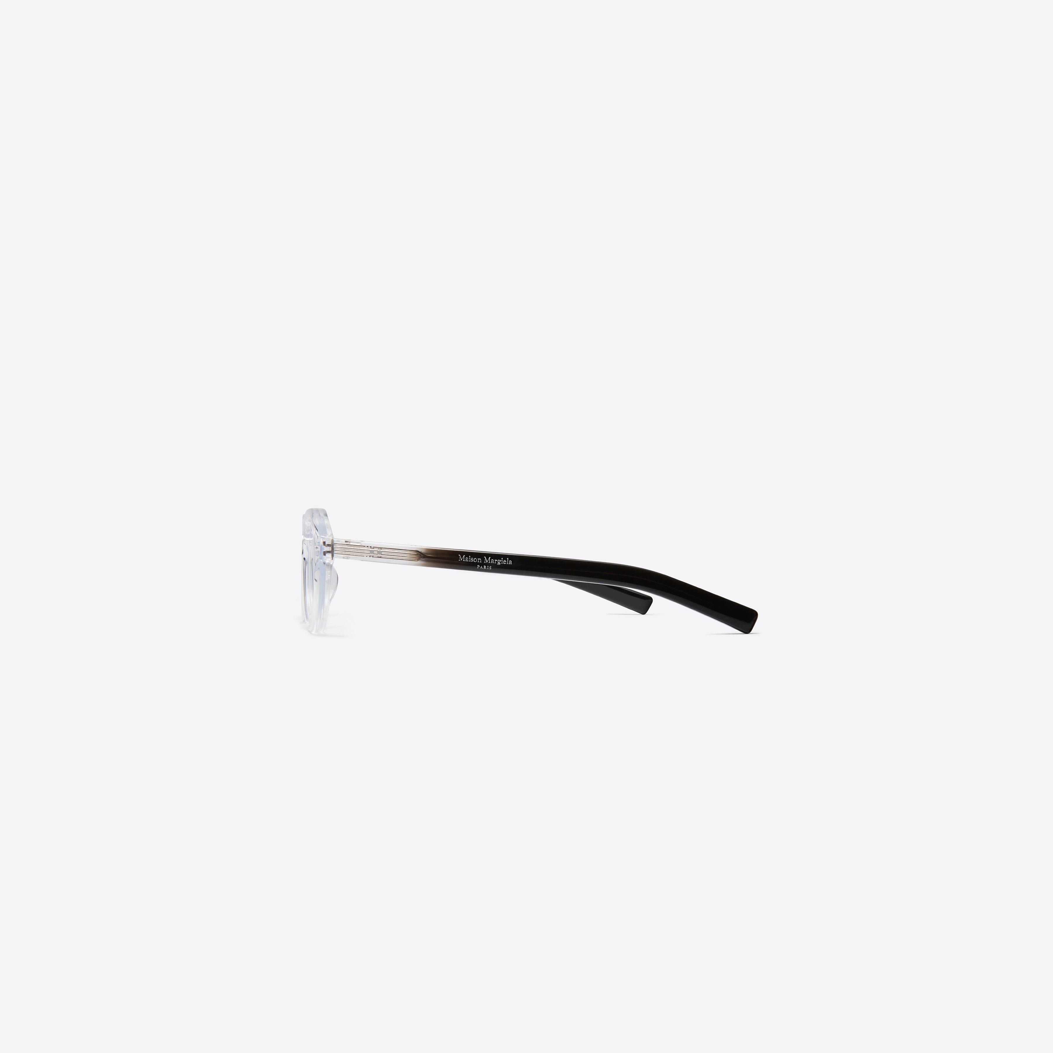 A detailed right view of Gentle Monster Maison Margiela - MM112 C1 Clear Acetate framed Aviator glasses.