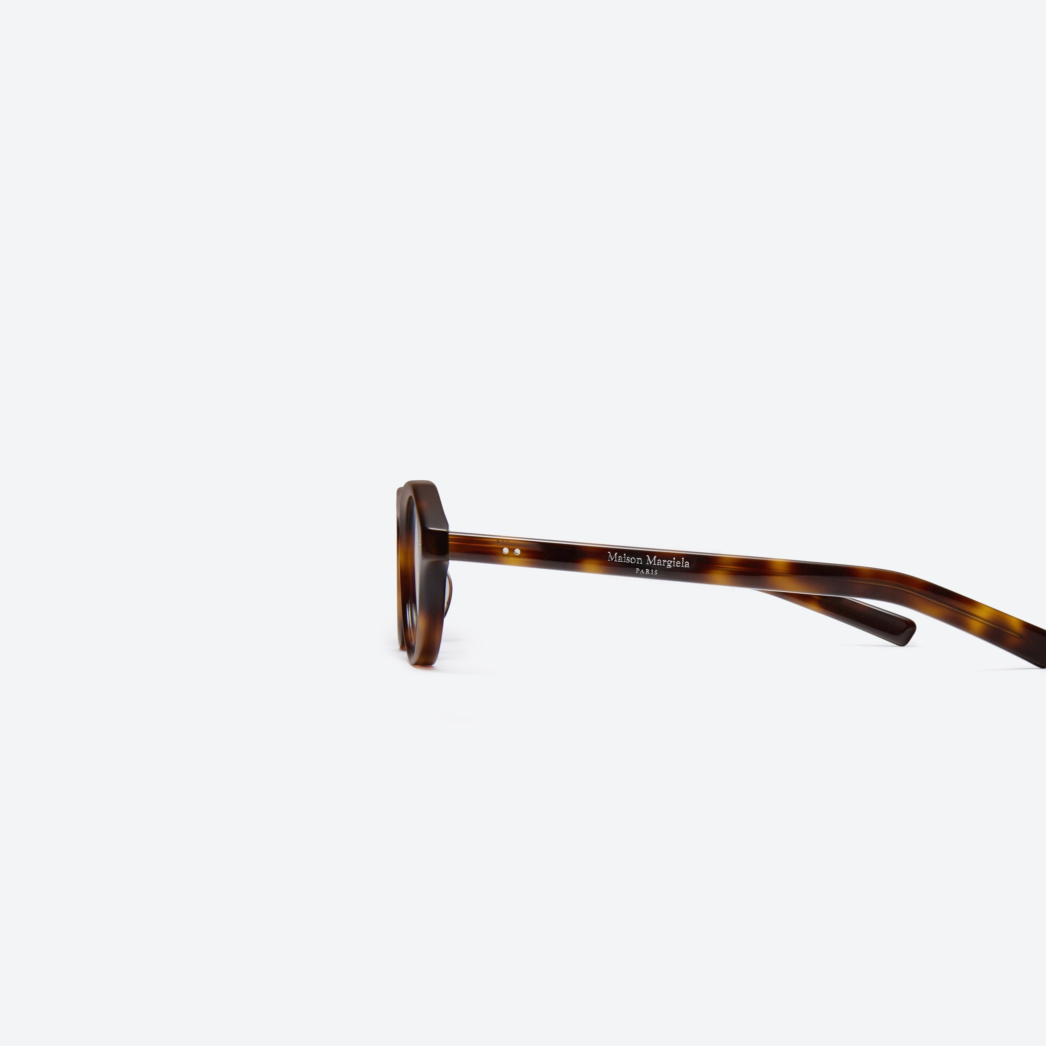A detailed left view of Gentle Monster Maison Margiela - MM112 L2 Tortoise Acetate framed Aviator glasses.