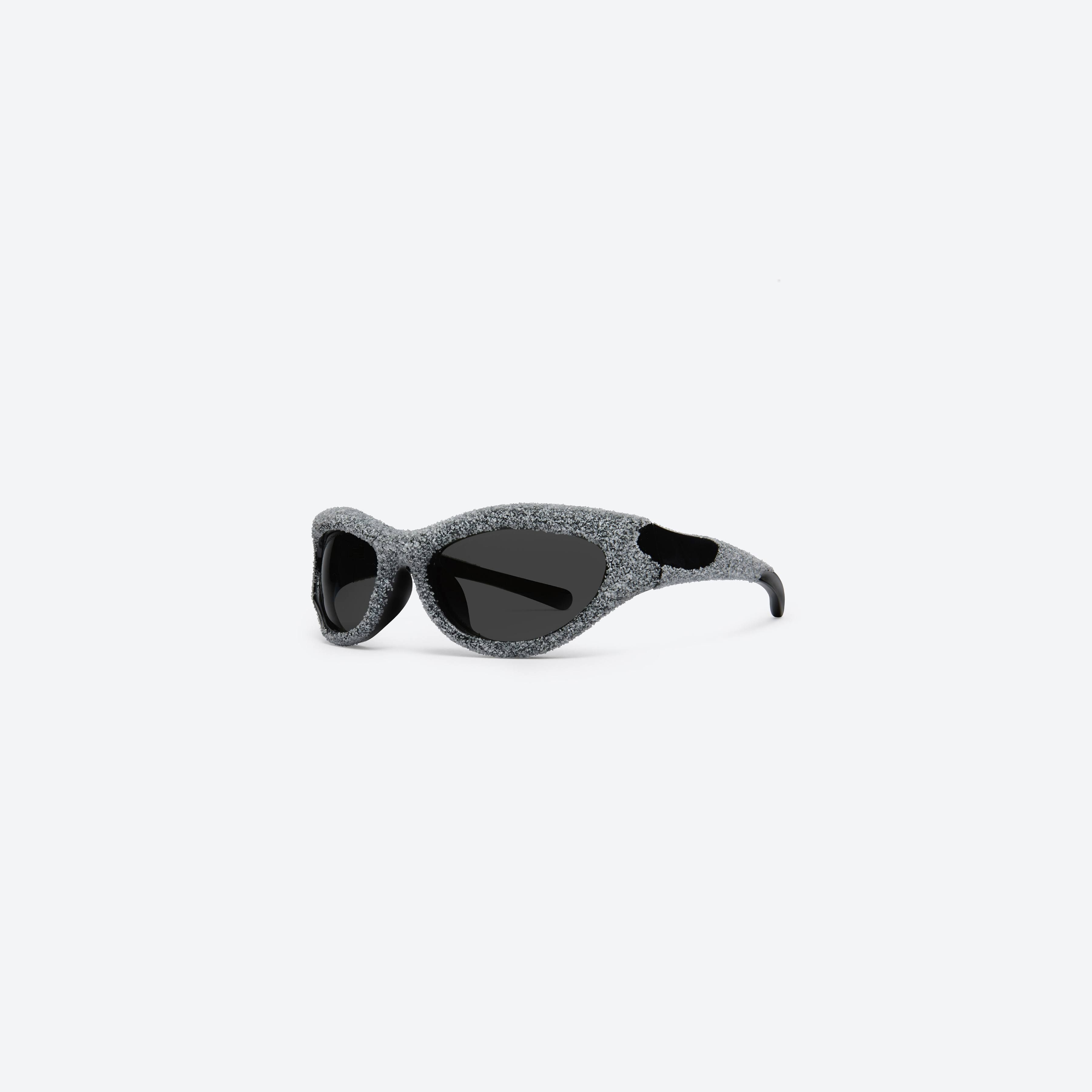 45-degree view of Gentle Monster Yummy 01 Black Nylon framed Wraparound sunglasses.