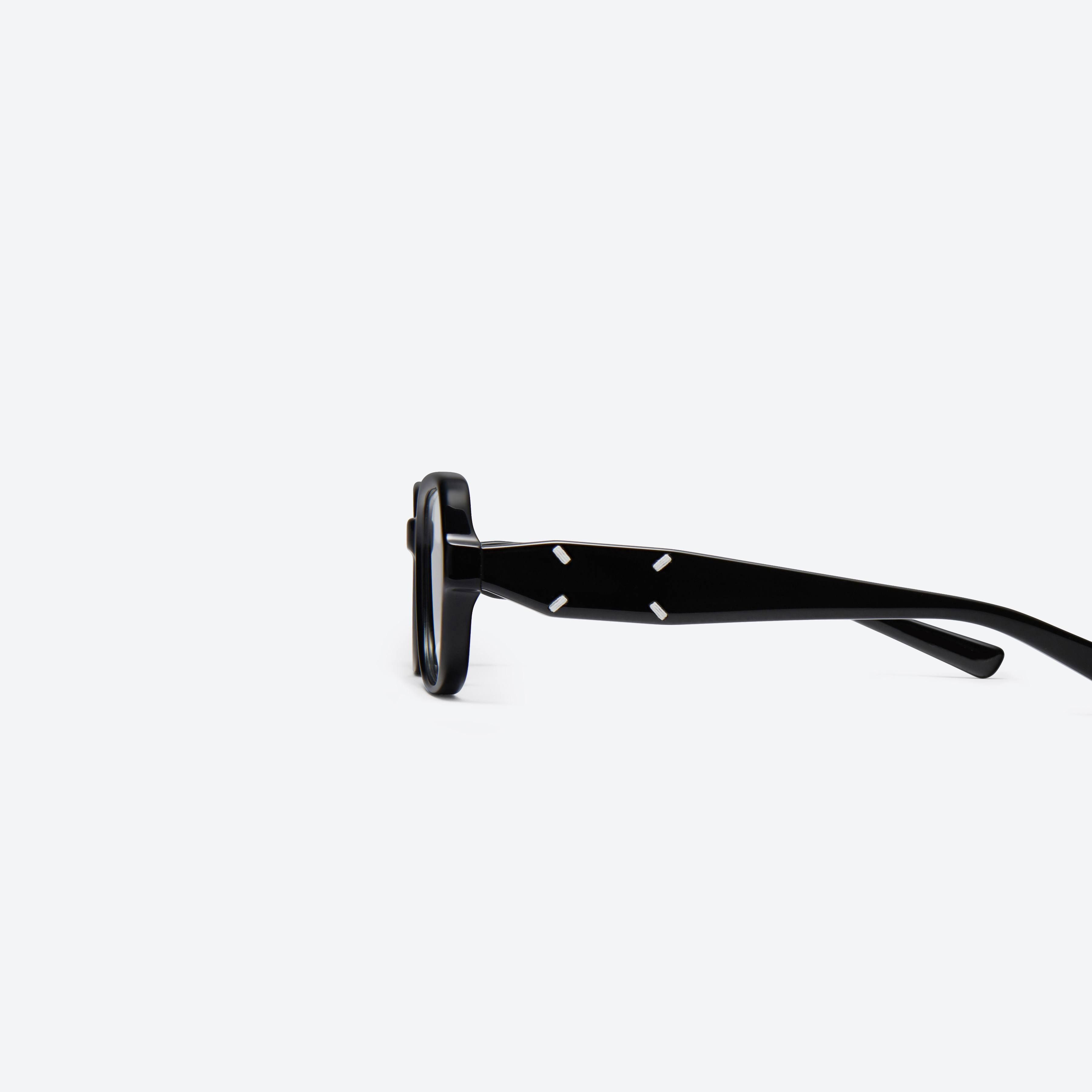 A detailed left view of Gentle Monster Maison Margiela - MM114 01 Black Acetate framed Square glasses.