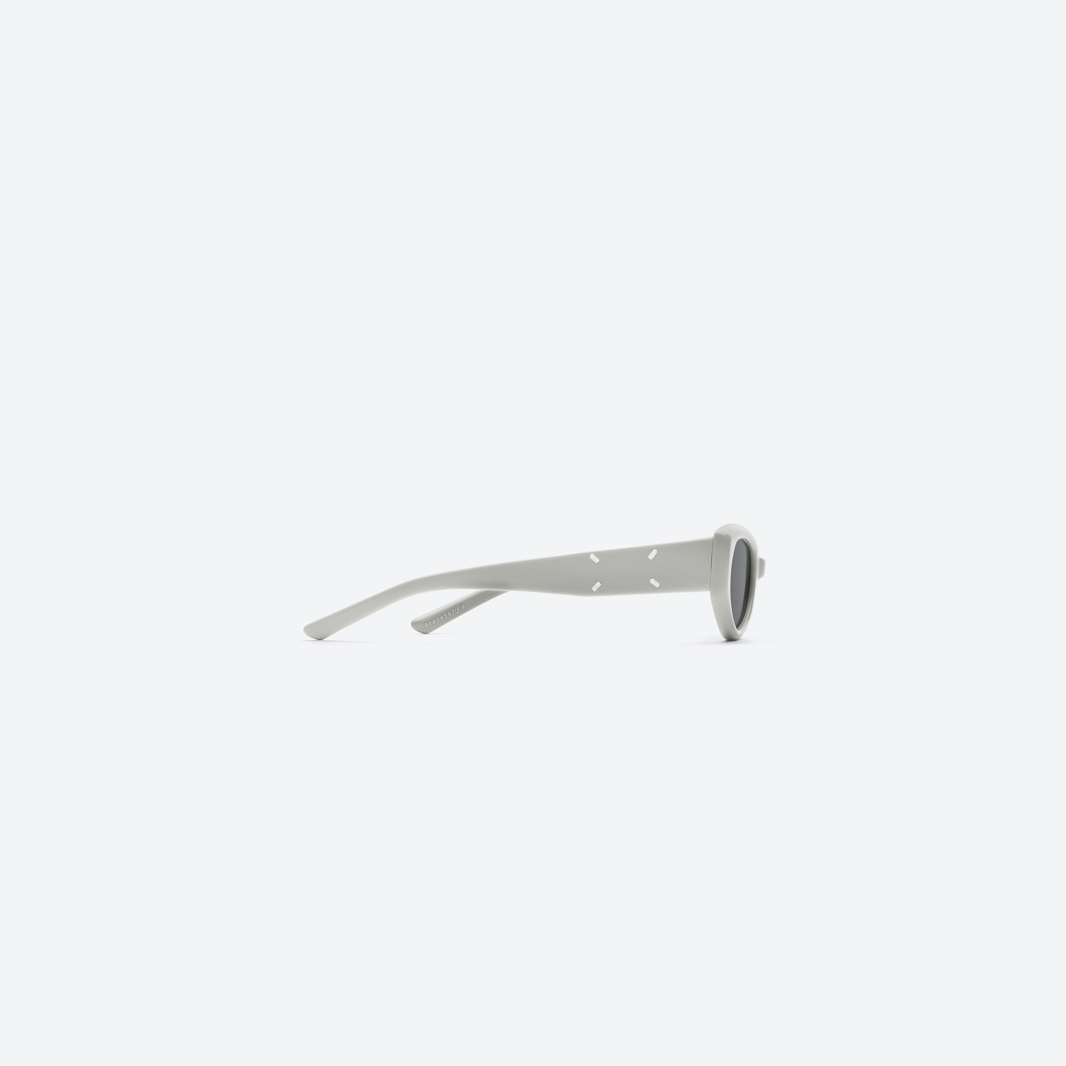 A detailed right view of Gentle Monster Maison Margiela - MM205 G12 Gray Acetate framed Cat-eye sunglasses.