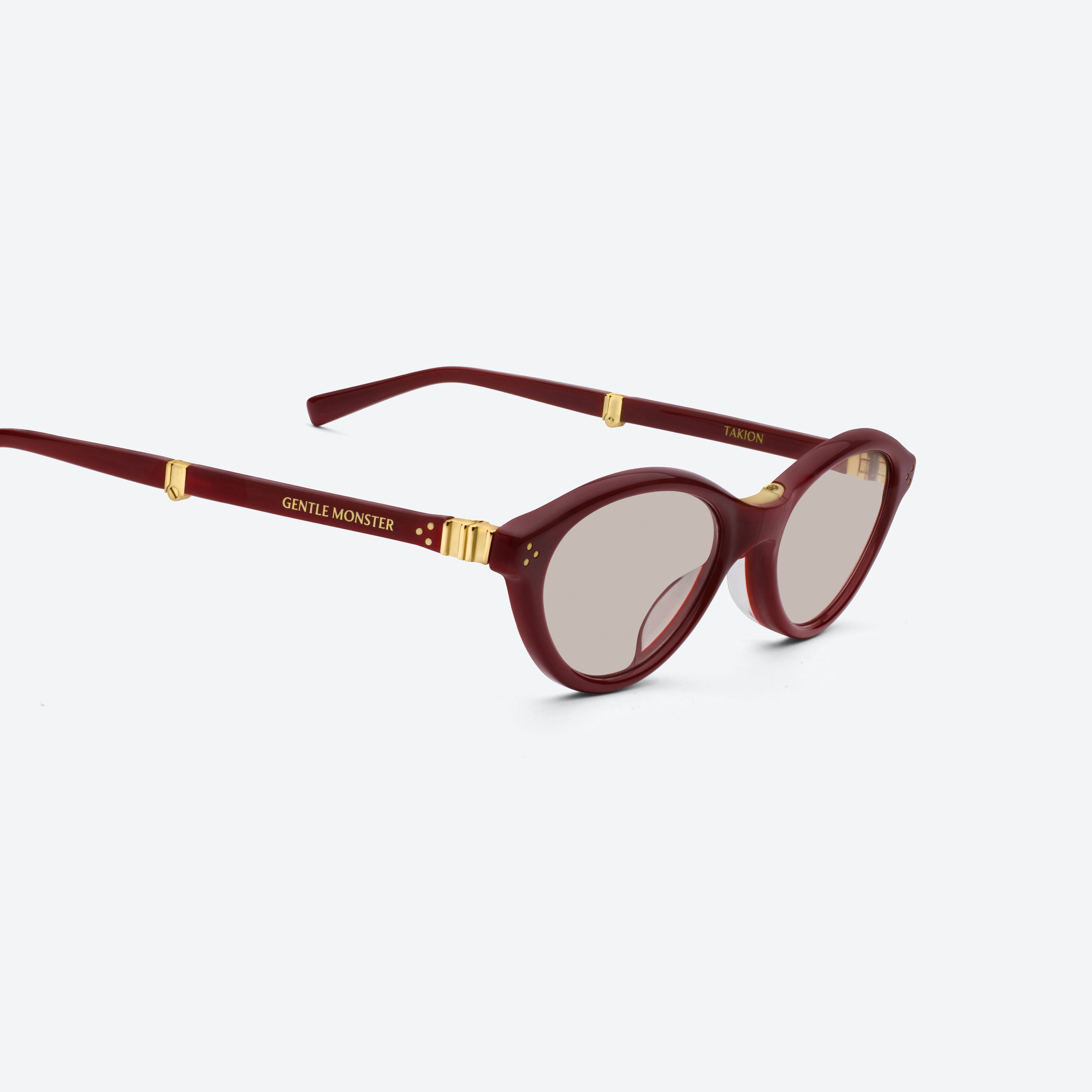 45-degree detailed view of Gentle Monster Takion R8 Red Acetate framed Round glasses.