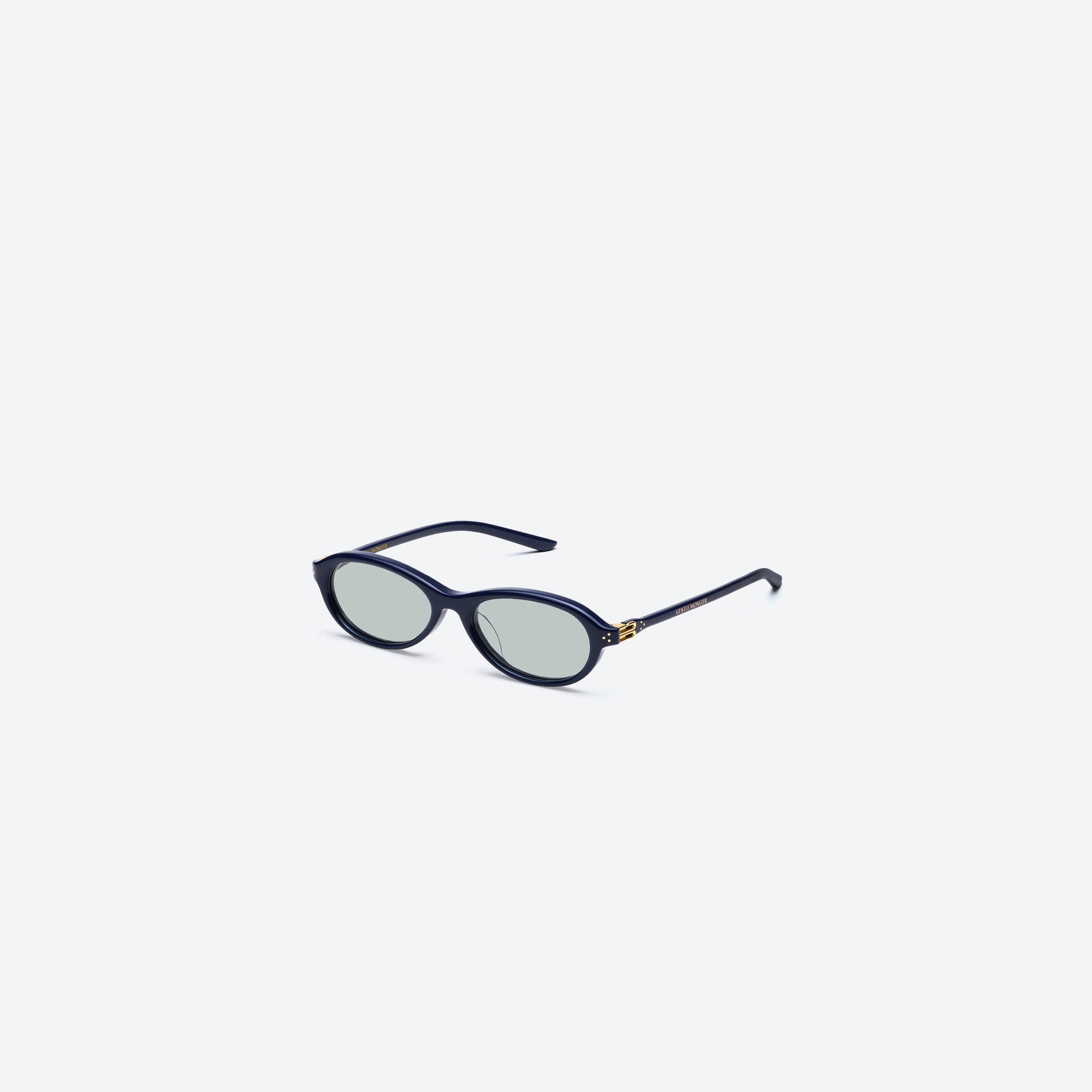 45-degree view of Gentle Monster Be Slo N6 Blue Acetate framed Aviator glasses.
