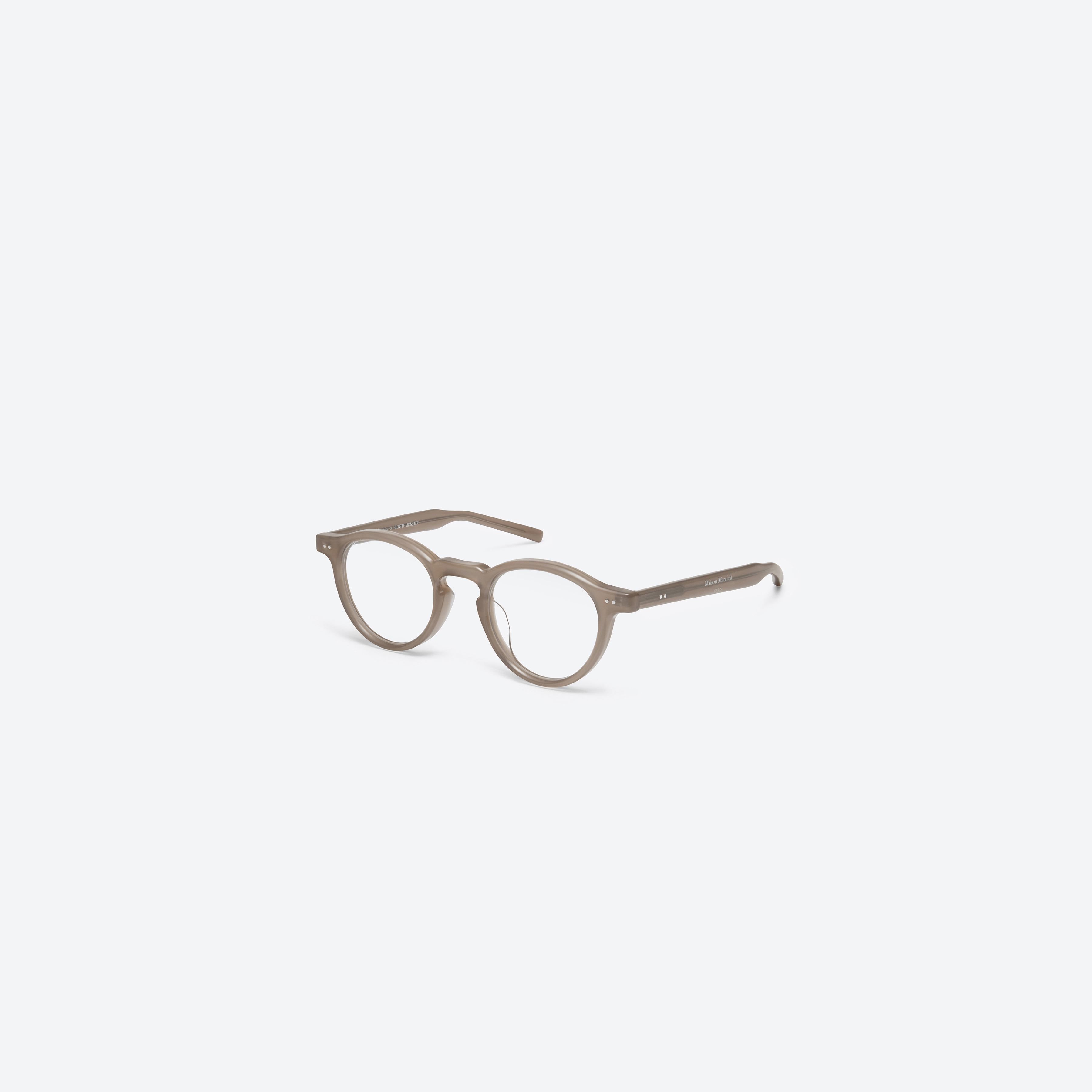45-degree view of Gentle Monster Maison Margiela - MM116 BRC9 Brown Acetate framed Round glasses.