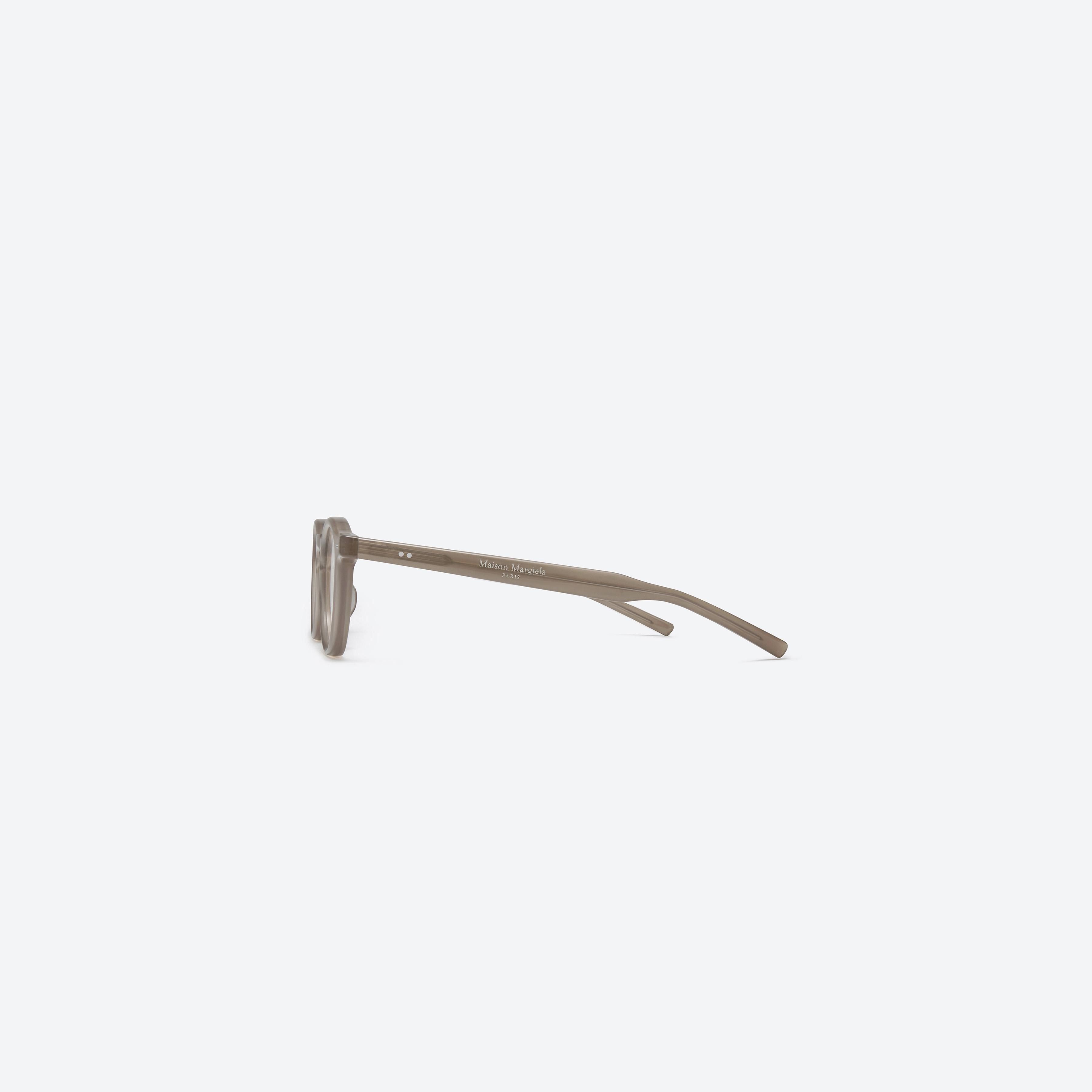 A detailed right view of Gentle Monster Maison Margiela - MM116 BRC9 Brown Acetate framed Round glasses.