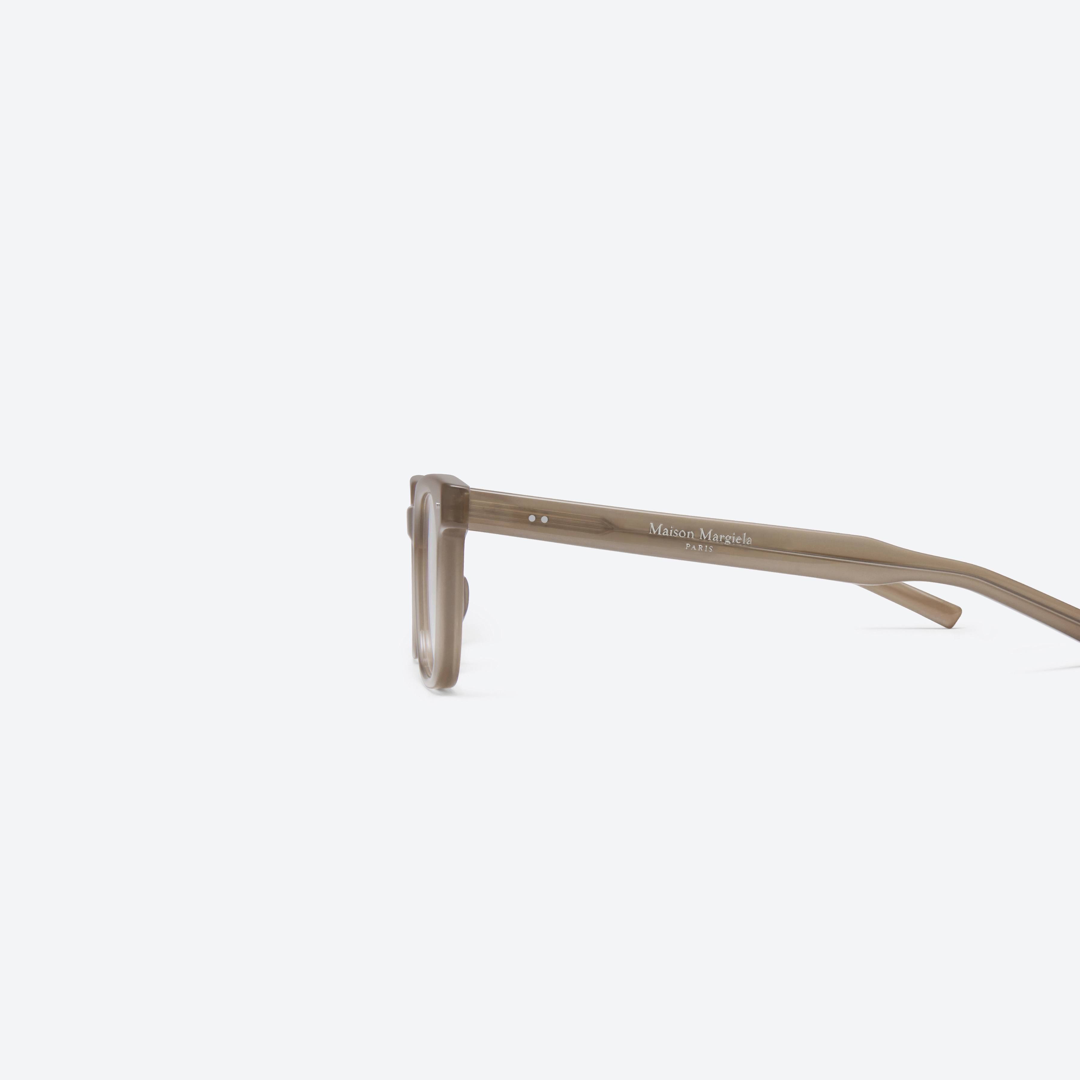 A detailed right view of Gentle Monster MM117 BRC9 Brown Acetate framed Square glasses.