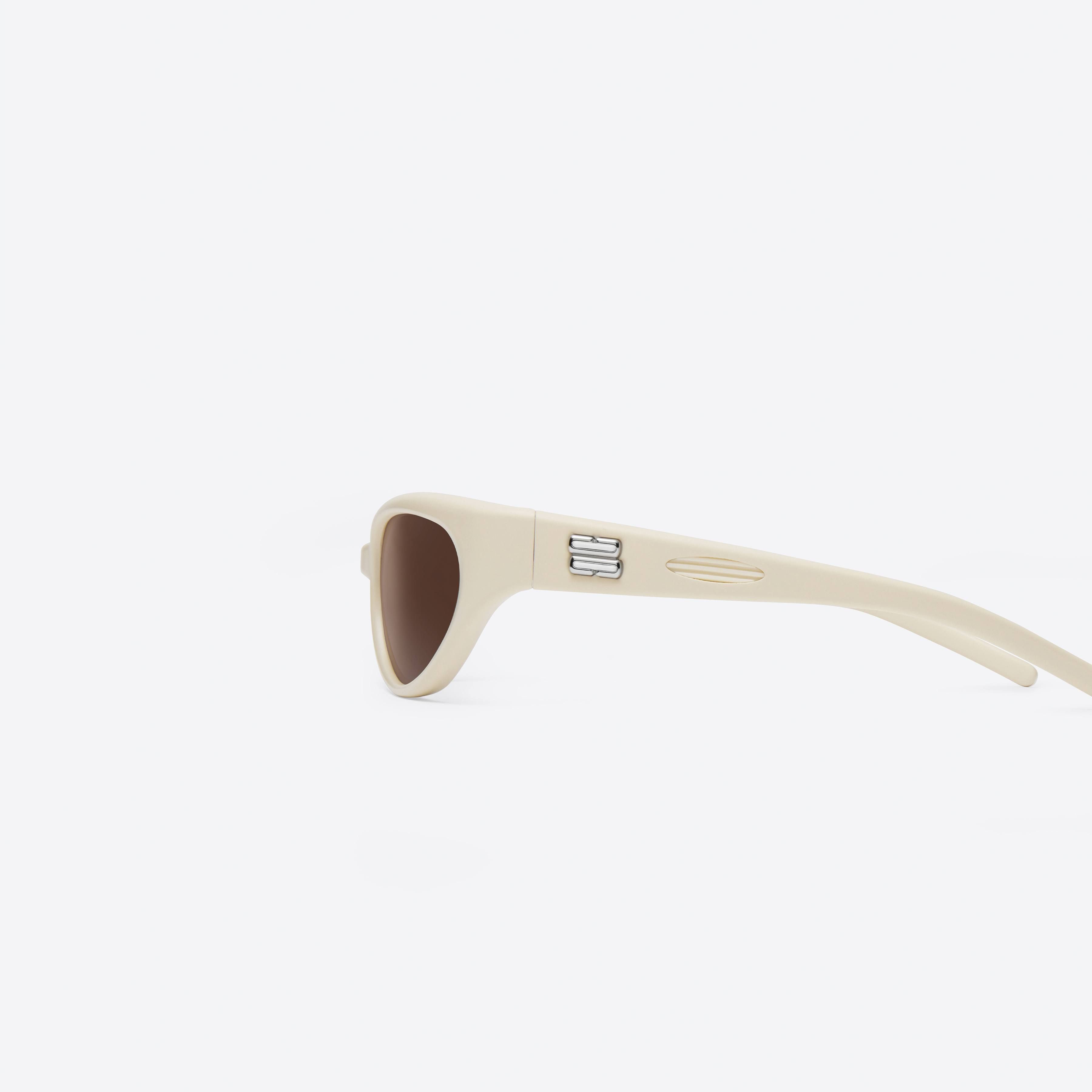 A detailed left view of Gentle Monster Juicy IV2 Ivory Nylon framed Wraparound sunglasses.