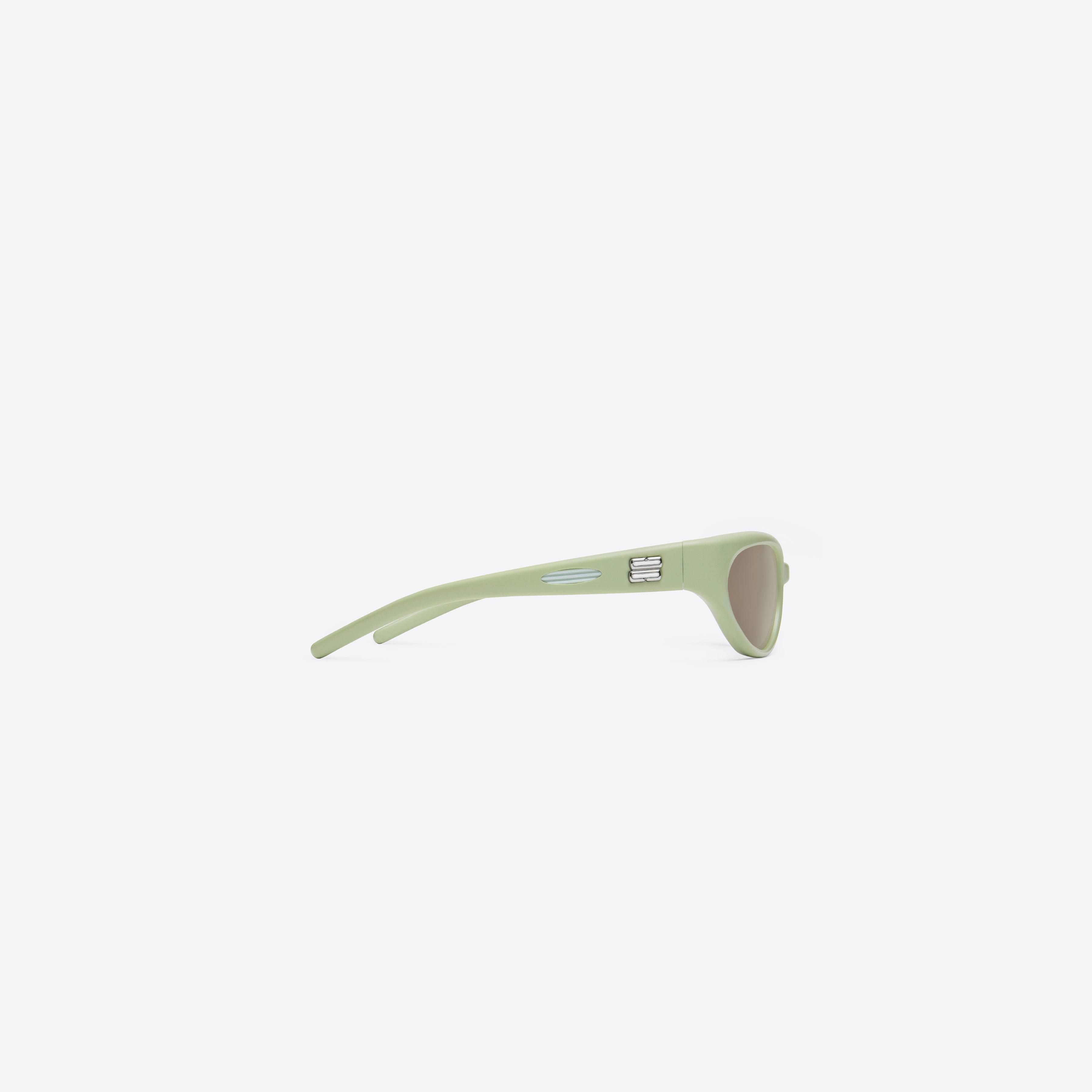 A detailed right view of Gentle Monster Juicy GR7 Green Nylon framed Wraparound sunglasses.