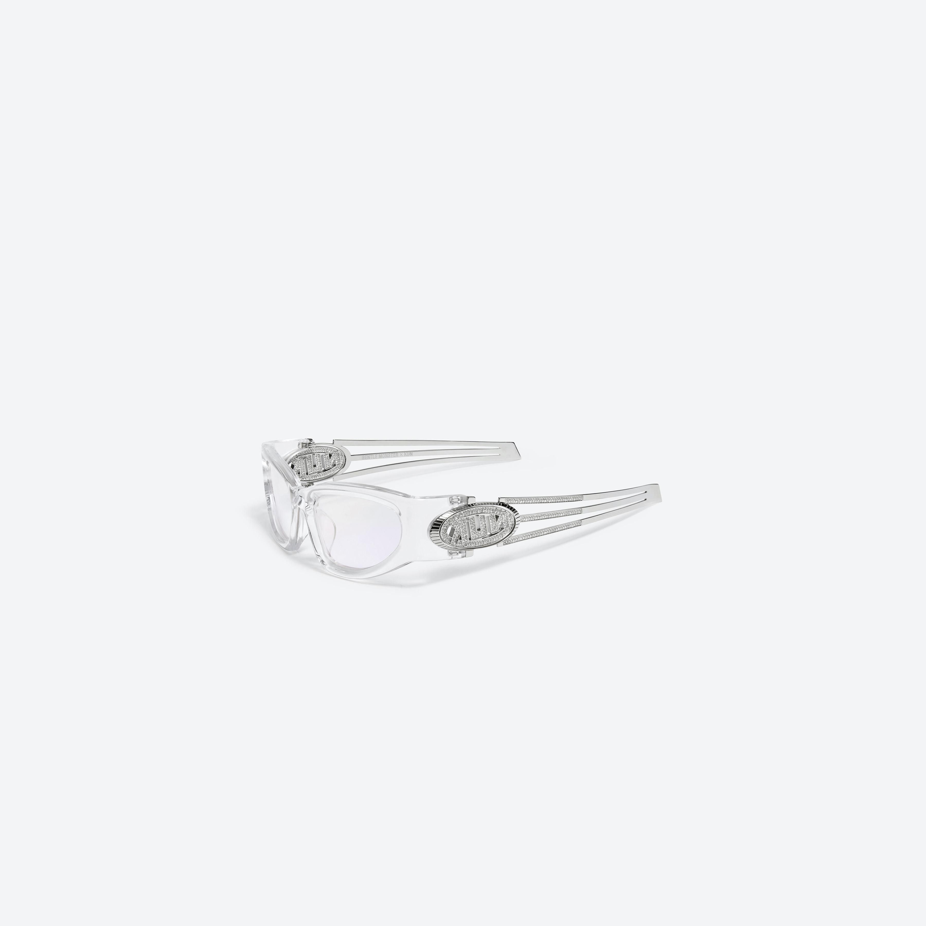 45-degree view of Gentle Monster KUN - 0001 C1 Clear Mixed framed Wraparound sunglasses.