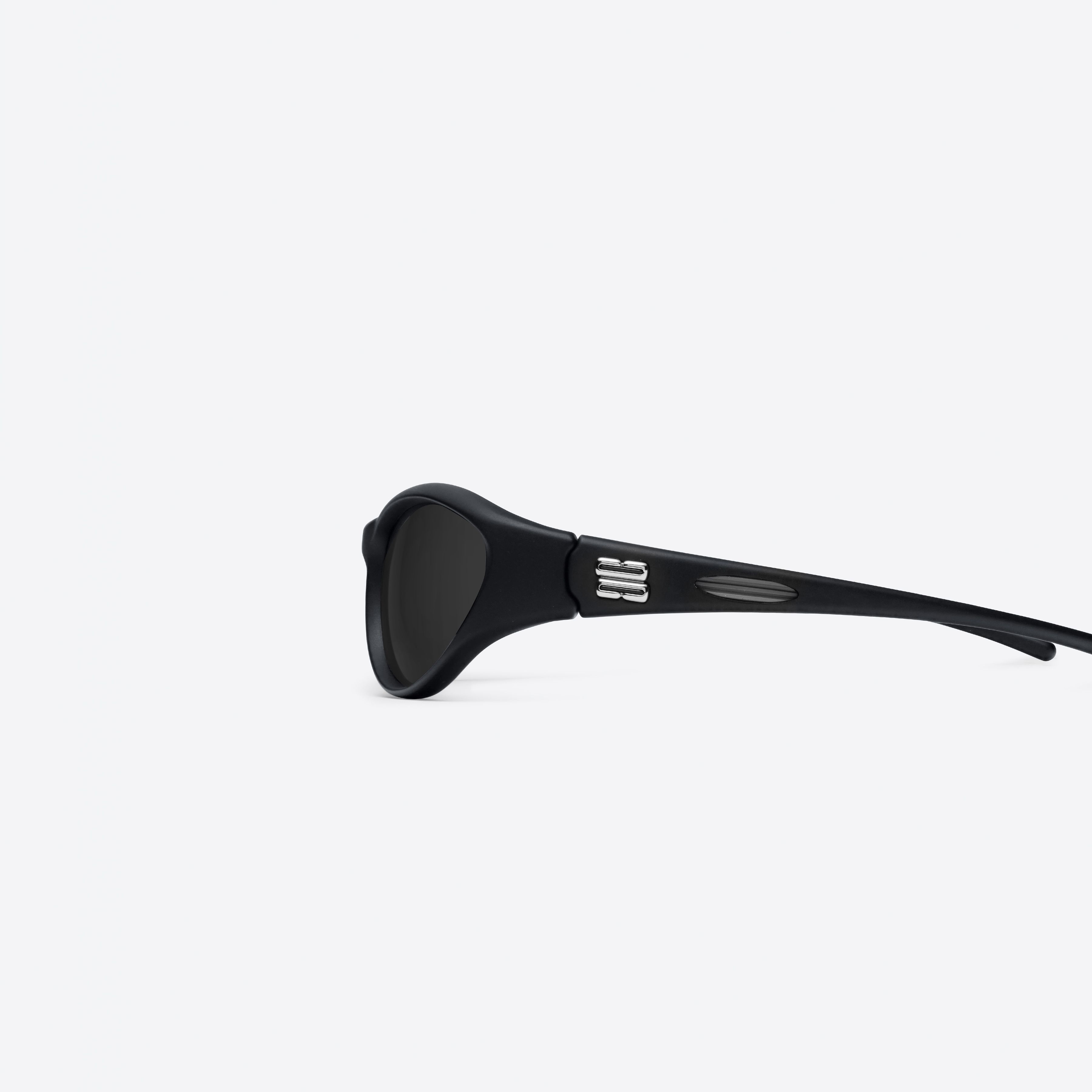 A detailed left view of Gentle Monster Sugar Buff 01 Black Nylon framed Wraparound sunglasses.