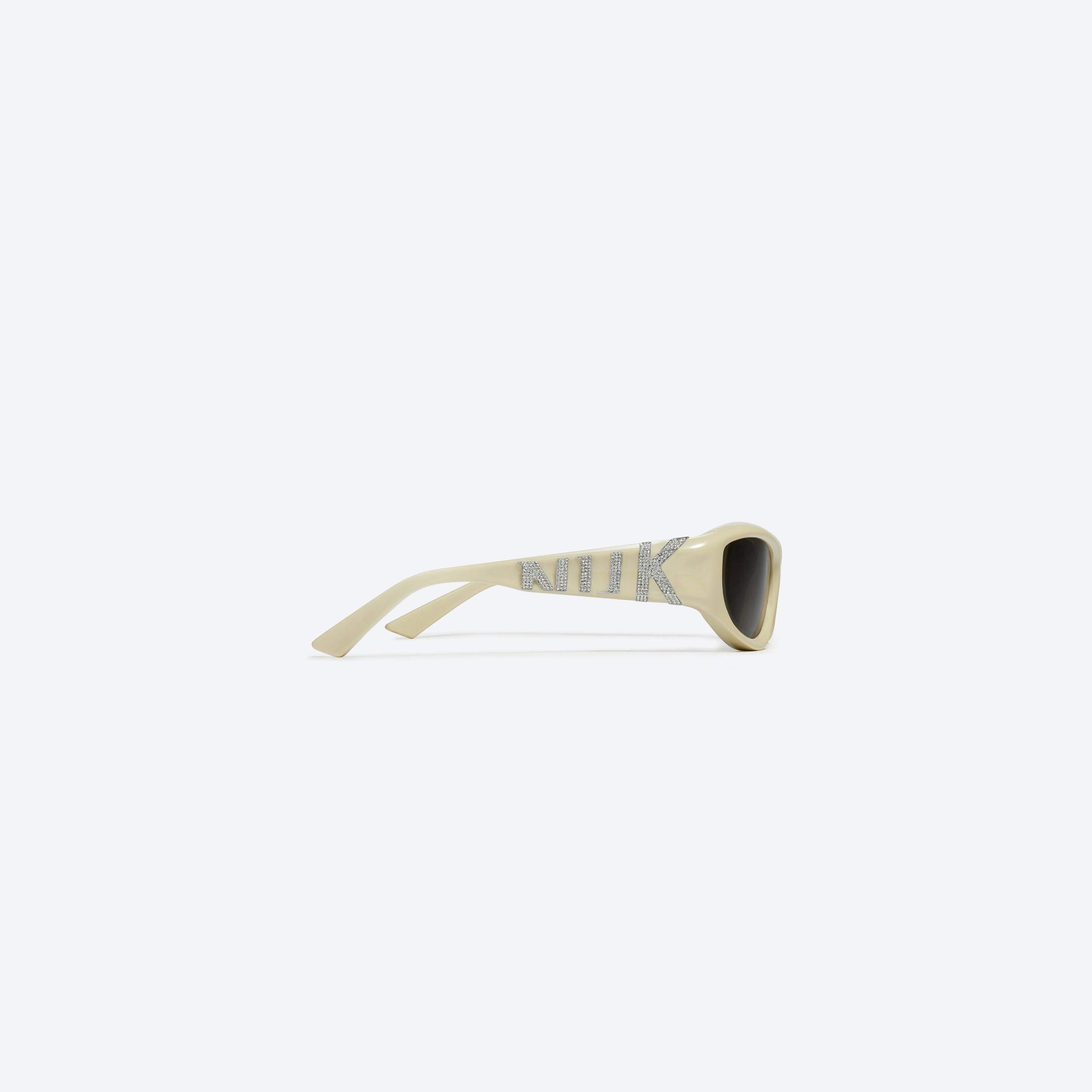A detailed right view of Gentle Monster KUN - 0002 Y5 Yellow Mixed framed Wraparound sunglasses.