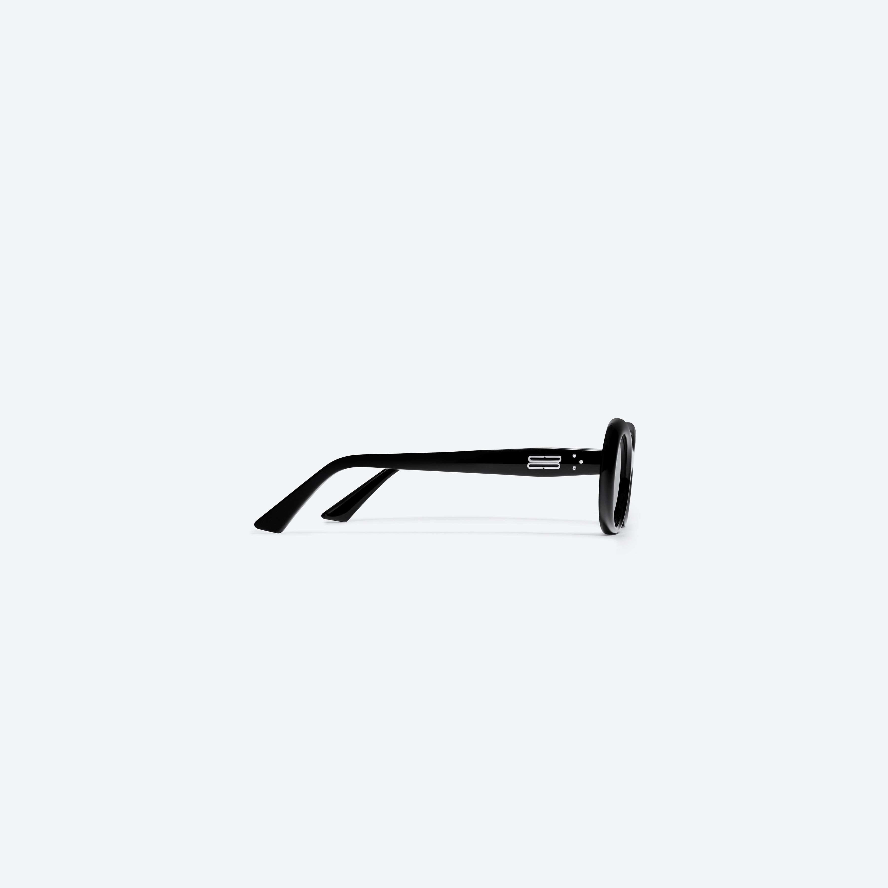 A detailed right view of Gentle Monster KUN - 0003 01 Black Acetate framed Oval sunglasses.