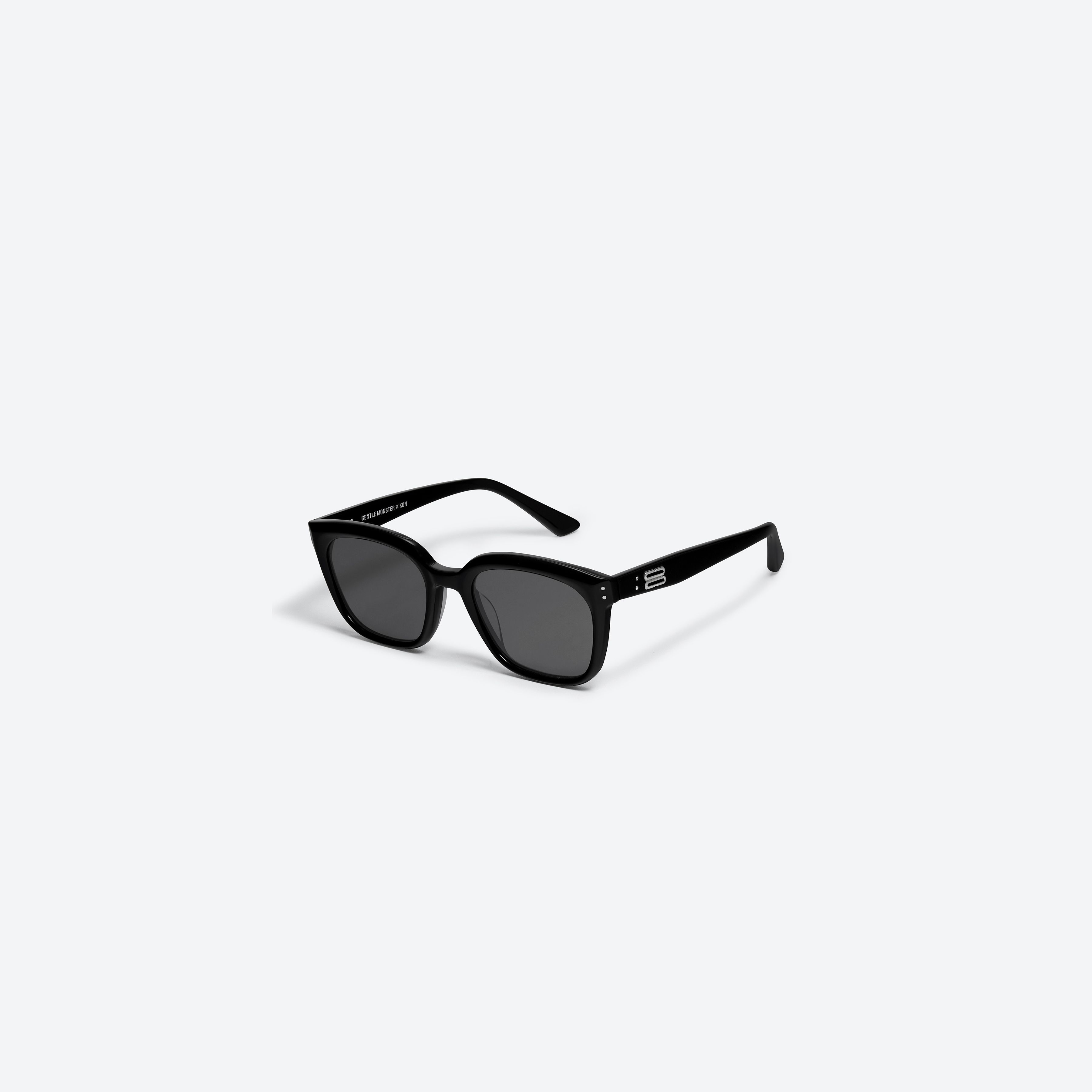 45-degree view of Gentle Monster KUN - 0004 01 Black Acetate framed Square sunglasses.