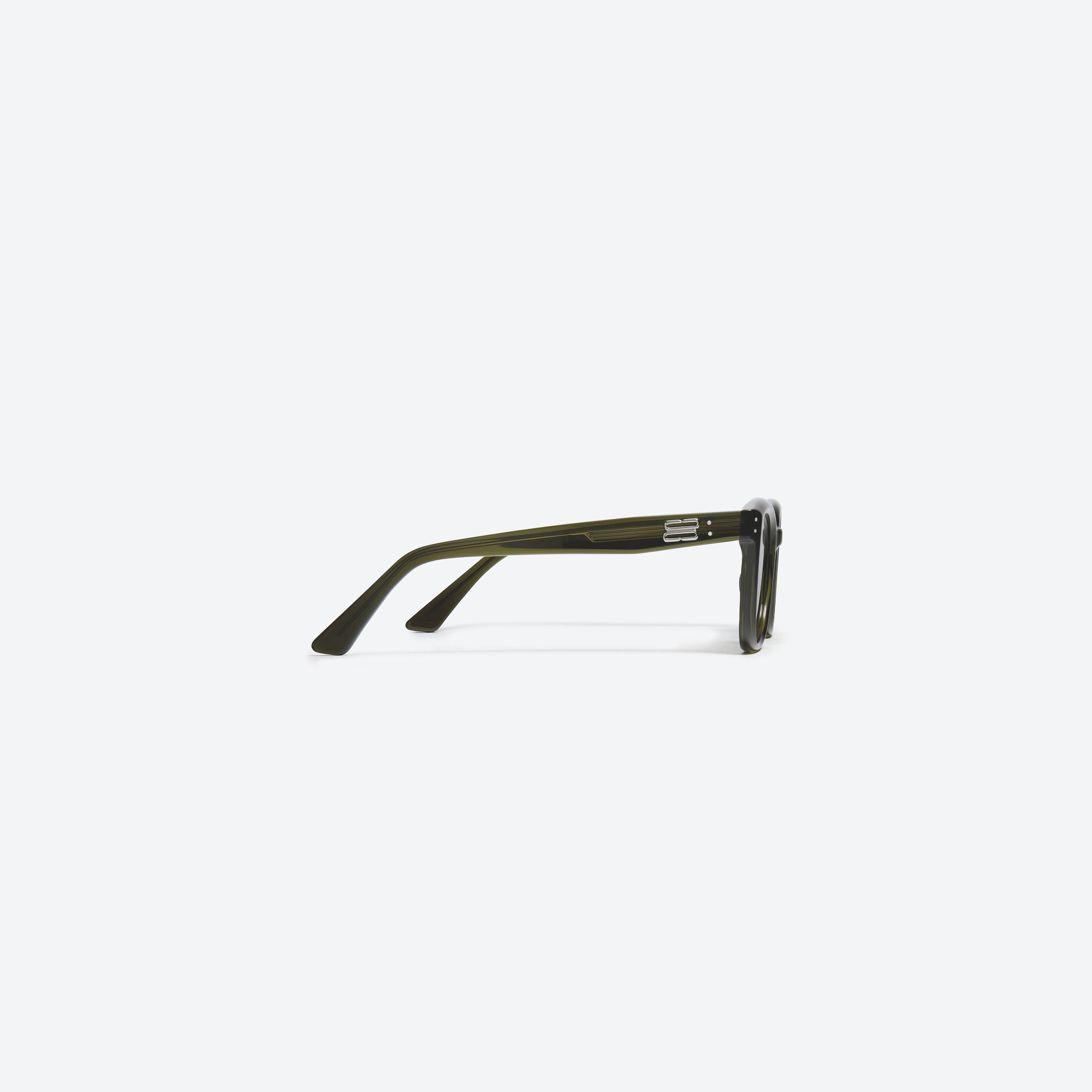 A detailed right view of Gentle Monster KUN - 0004 KC2 Green Acetate framed Square sunglasses.