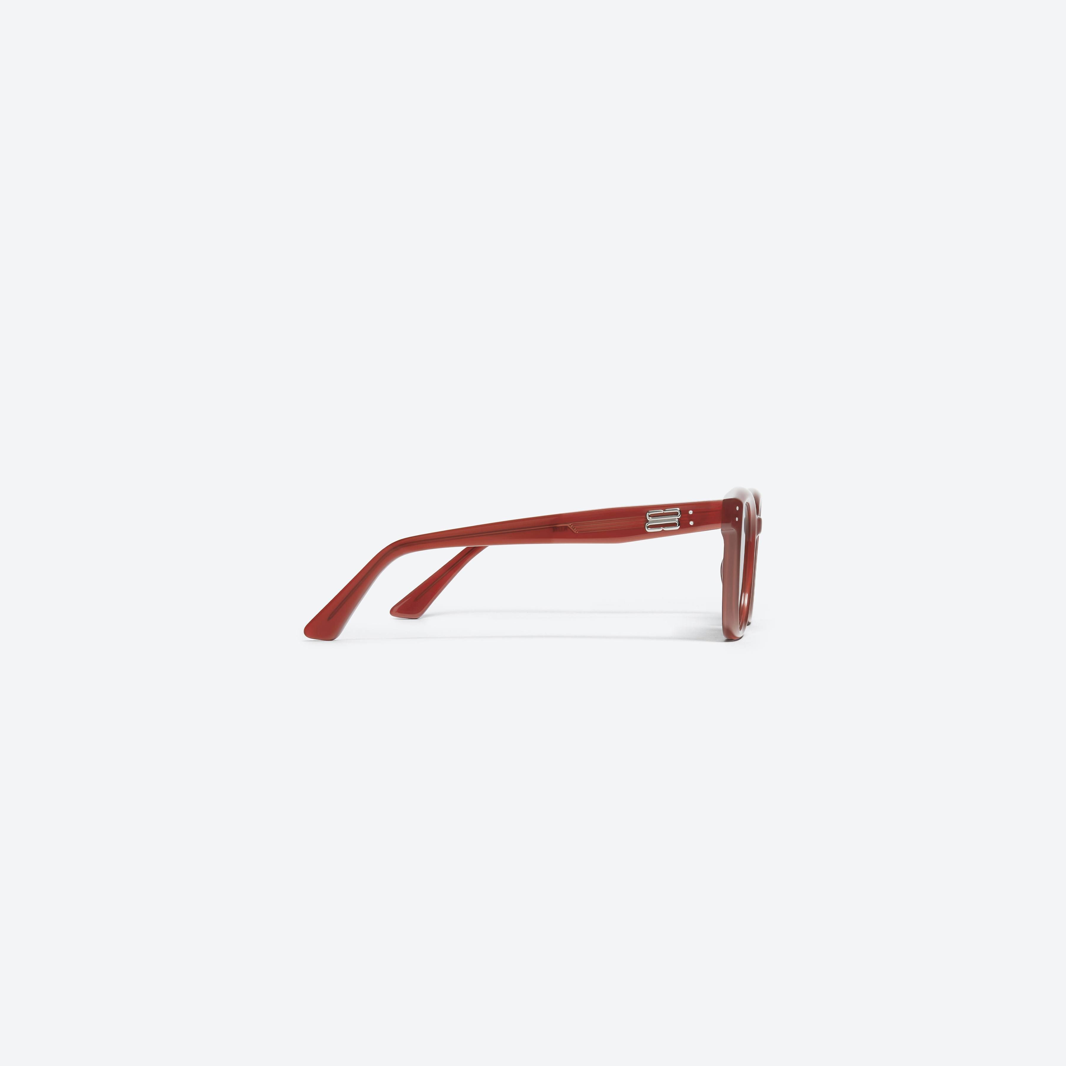 A detailed right view of Gentle Monster KUN - 0004 RD1 Red Acetate framed Square sunglasses.