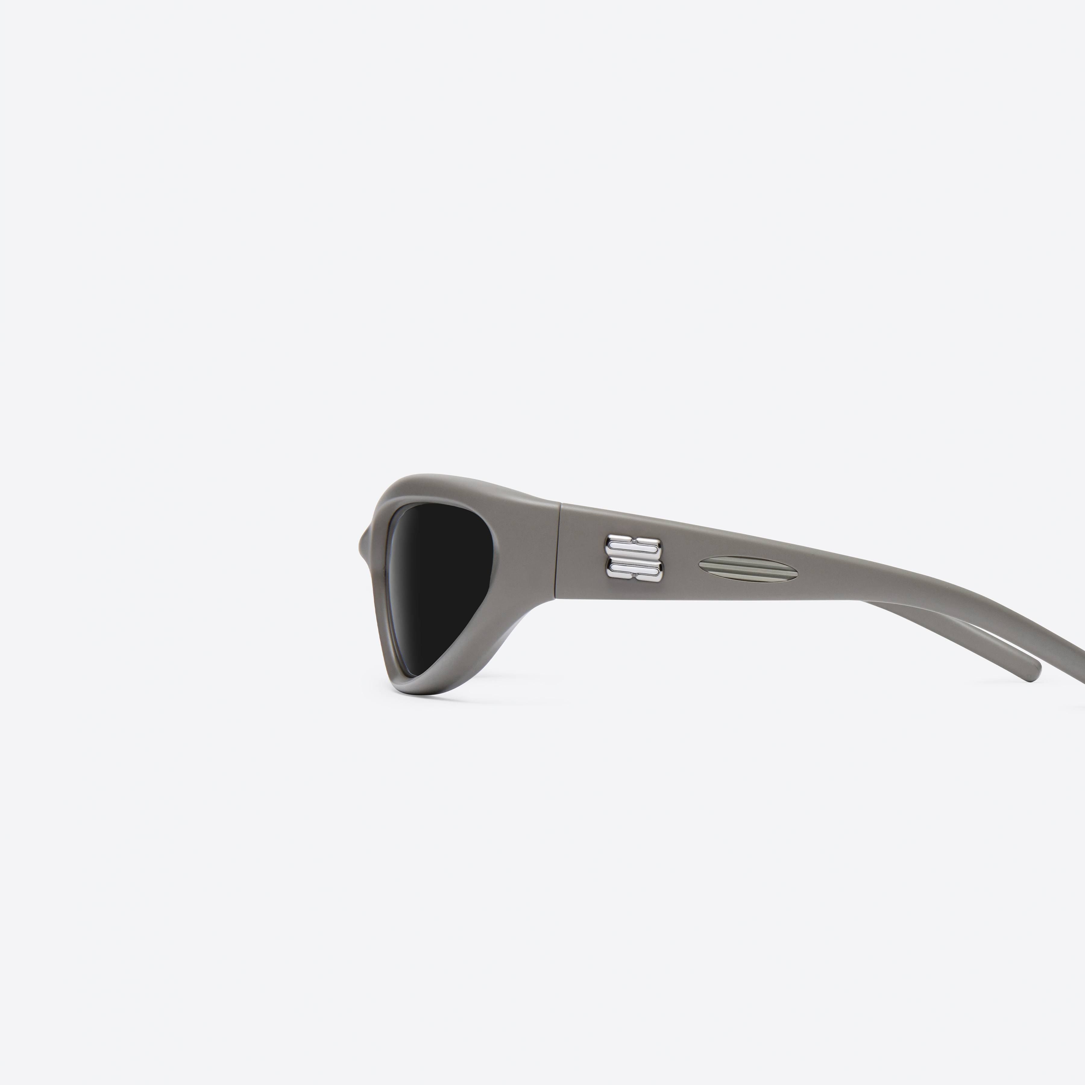 A detailed left view of Gentle Monster Panna Cotta K5 Green Nylon framed Wraparound sunglasses.