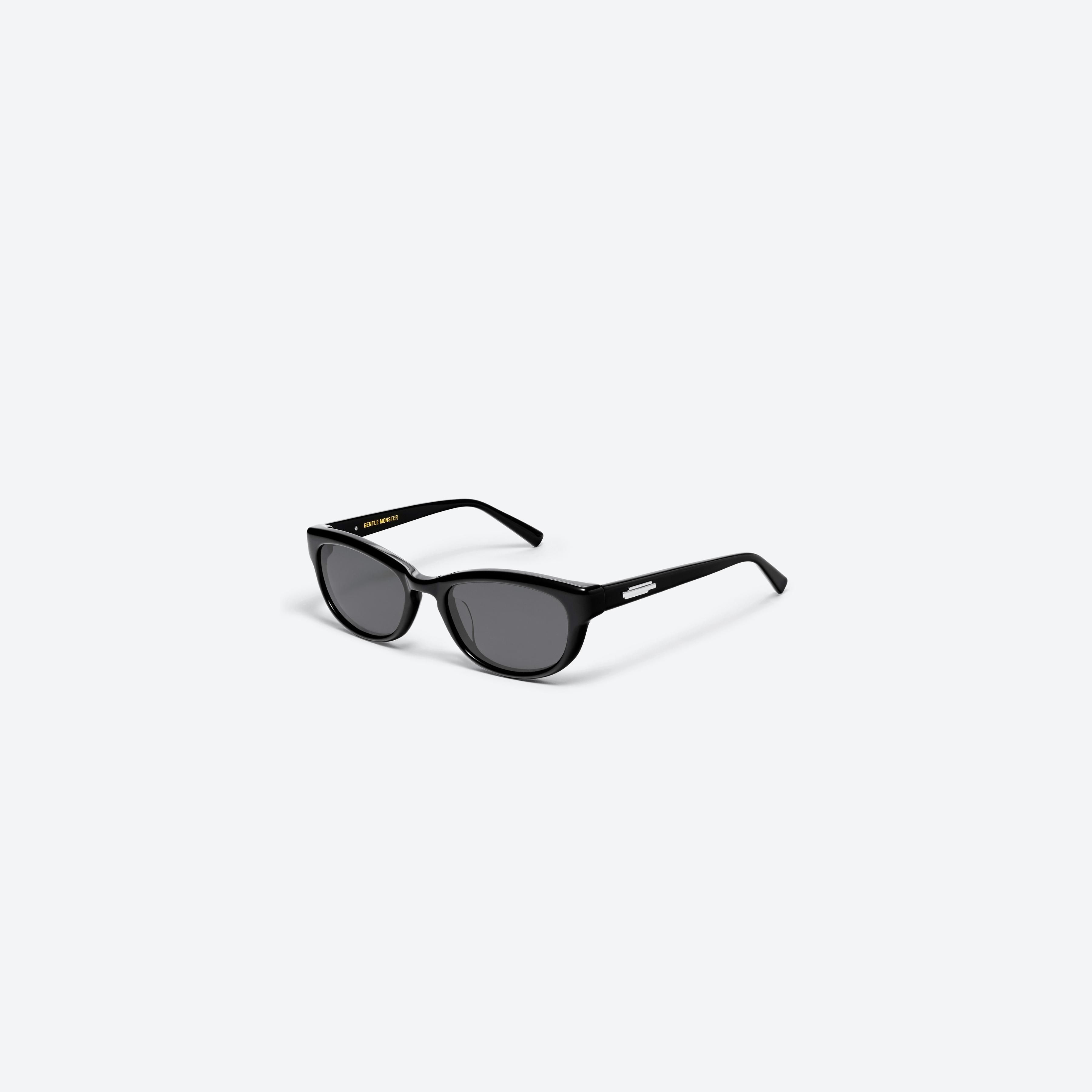 45-degree view of Gentle Monster Reny 01 Black Acetate framed Wraparound sunglasses.
