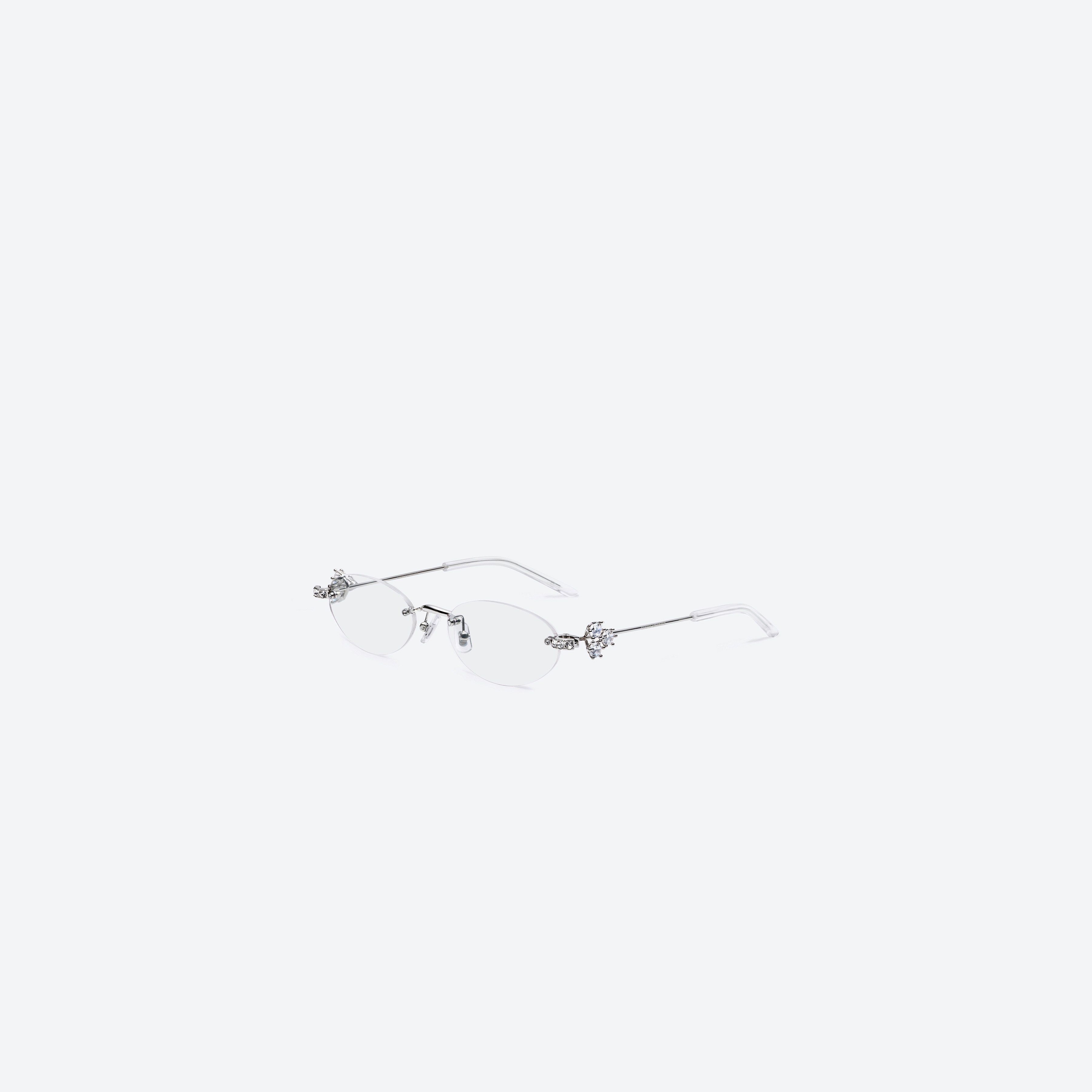 45-degree view of Gentle Monster Orora 02 Silver Metal framed Oval sunglasses.