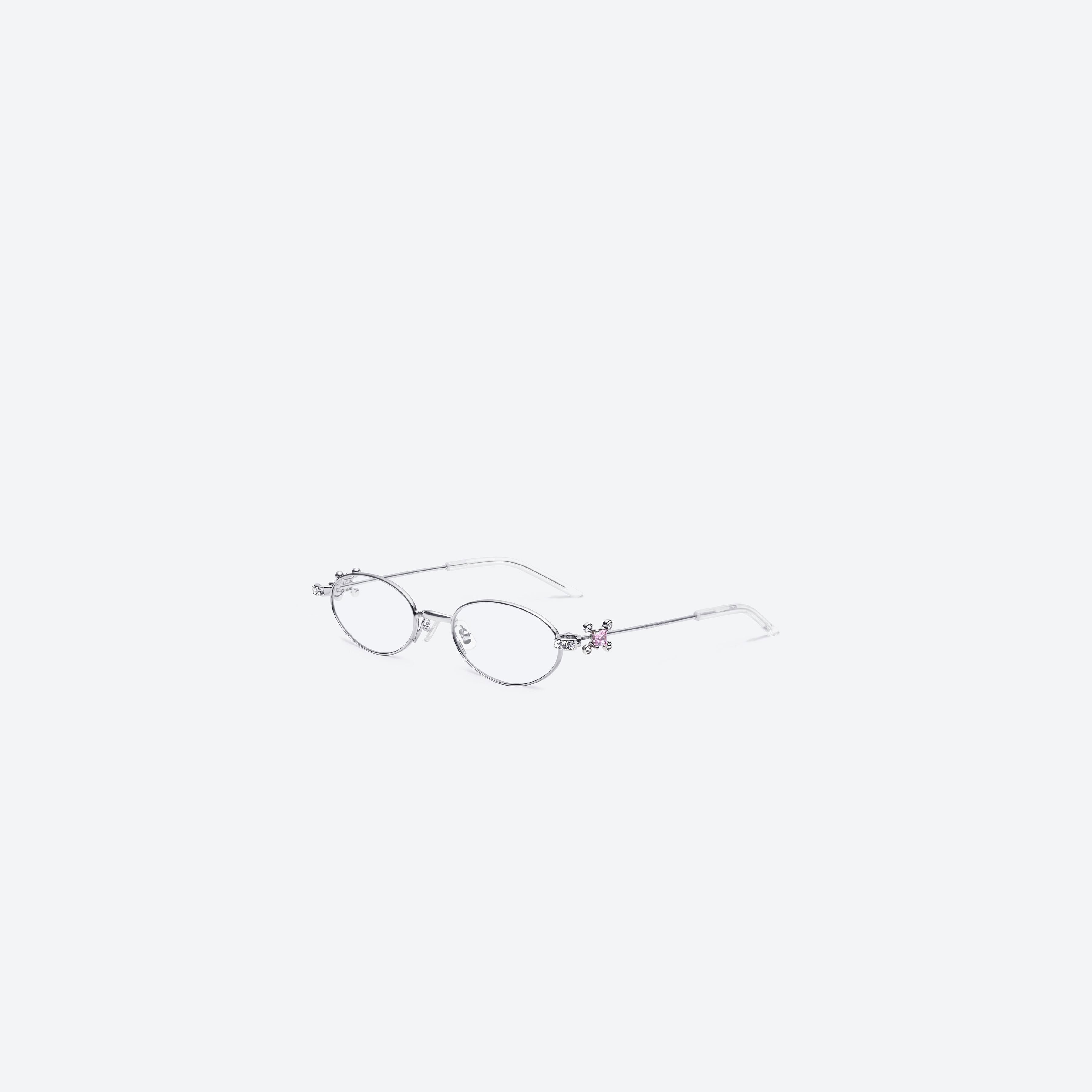 45-degree view of Gentle Monster On Ring 02 Silver Metal framed Oval sunglasses.
