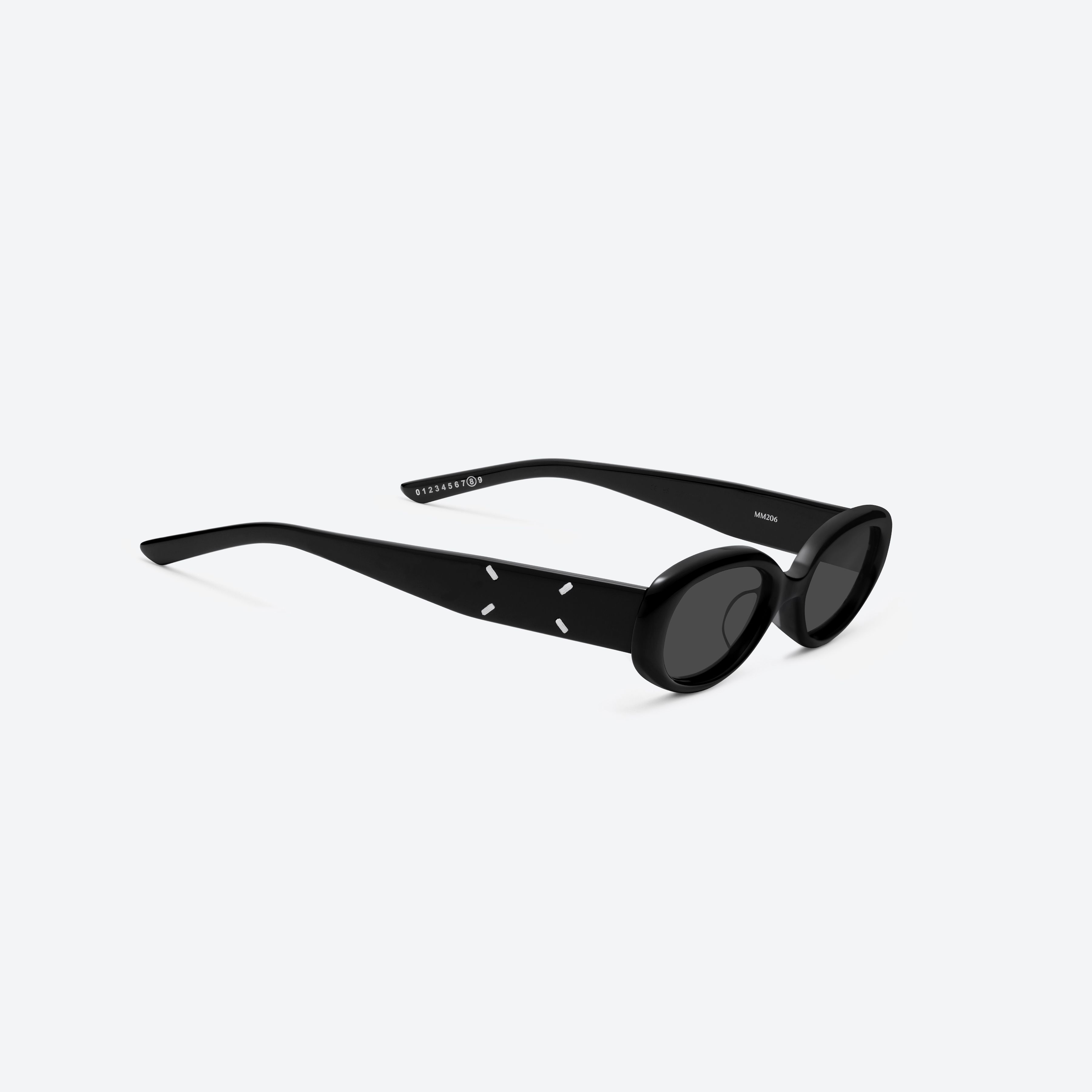 45-degree detailed view of Gentle Monster MM206 01 Black Acetate framed Oval sunglasses.