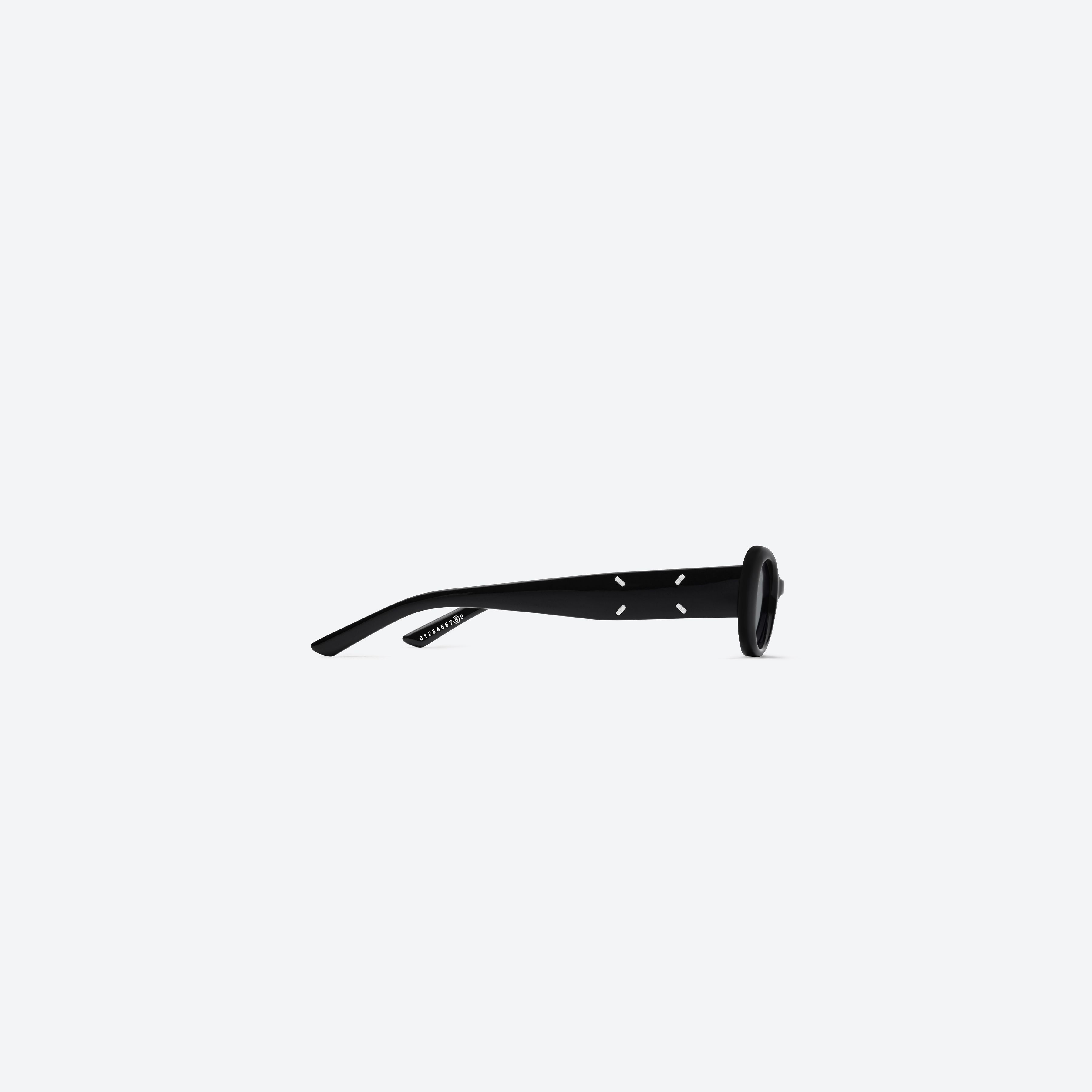 A detailed right view of Gentle Monster MM206 01 Black Acetate framed Oval sunglasses.
