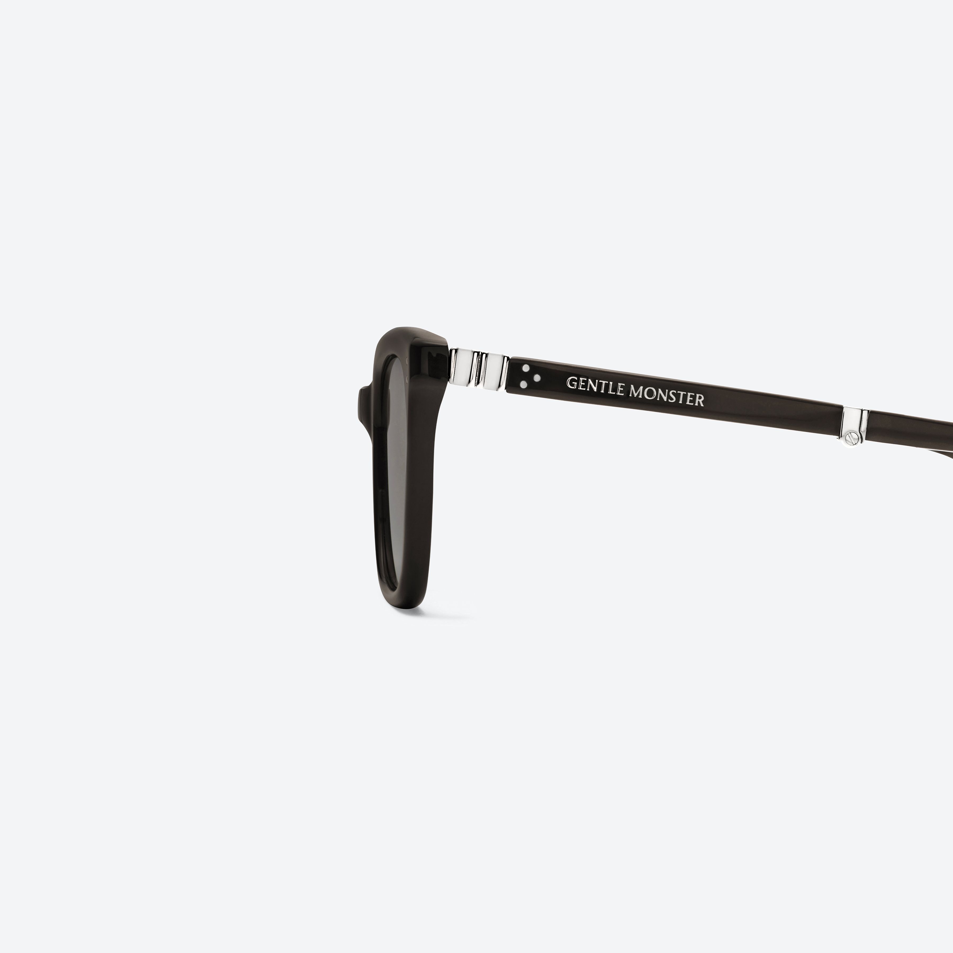 A detailed left view of Gentle Monster MATINY BR3 Brown Mixed framed Square sunglasses.