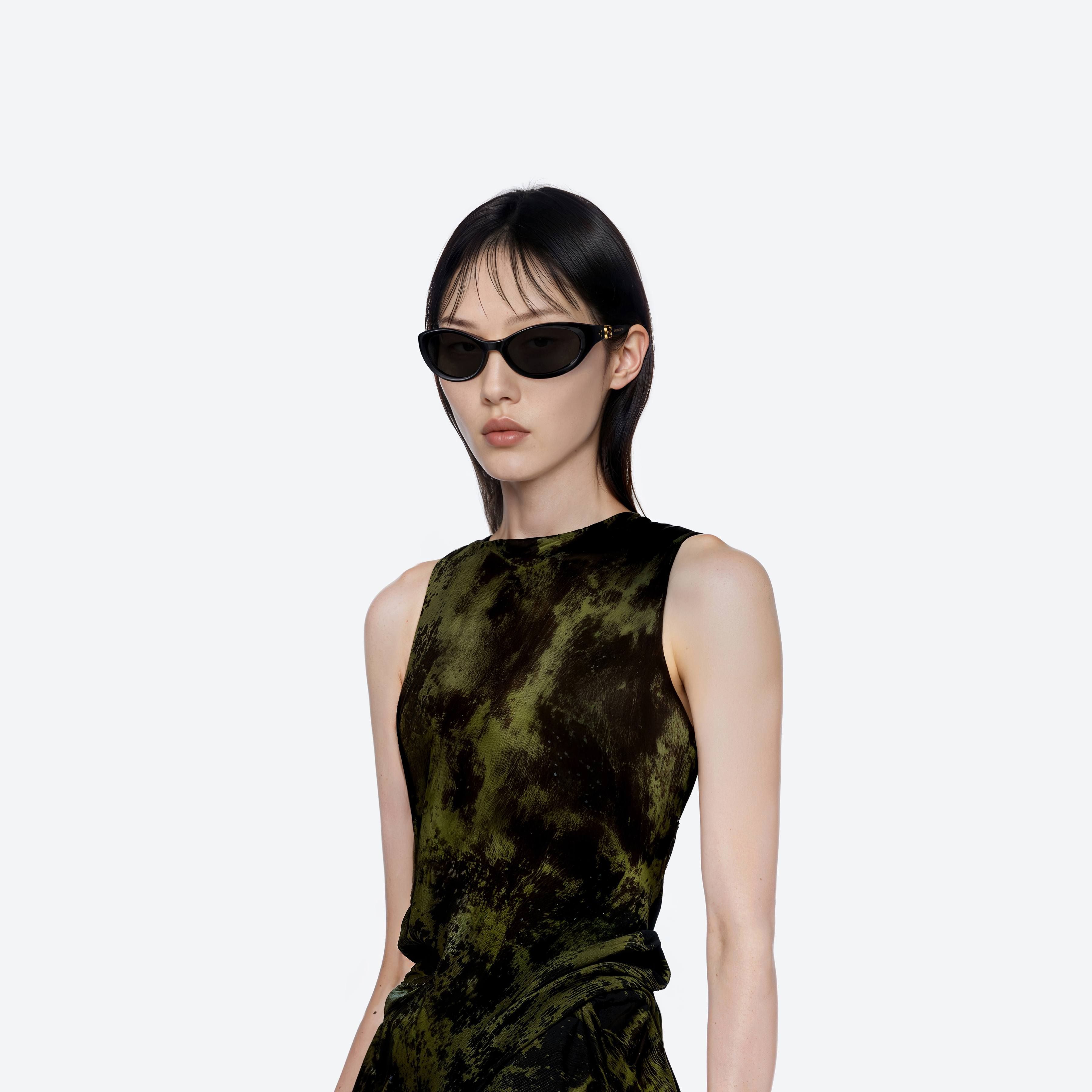 Model wearing the Ion 01 Black Acetate framed Wraparound sunglasses.