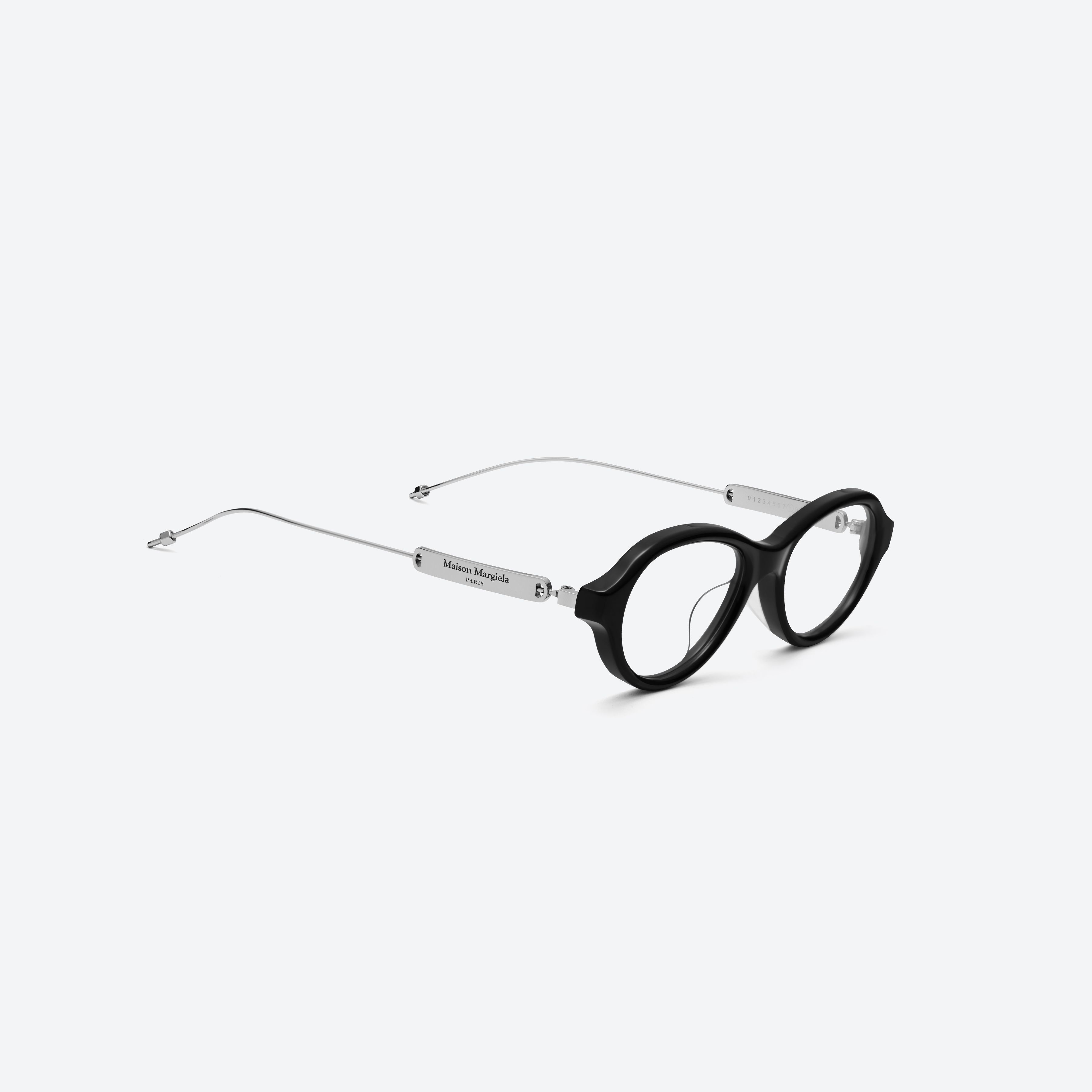 45-degree detailed view of Gentle Monster Maison Margiela - MM214 01 Black Mixed framed Round glasses.