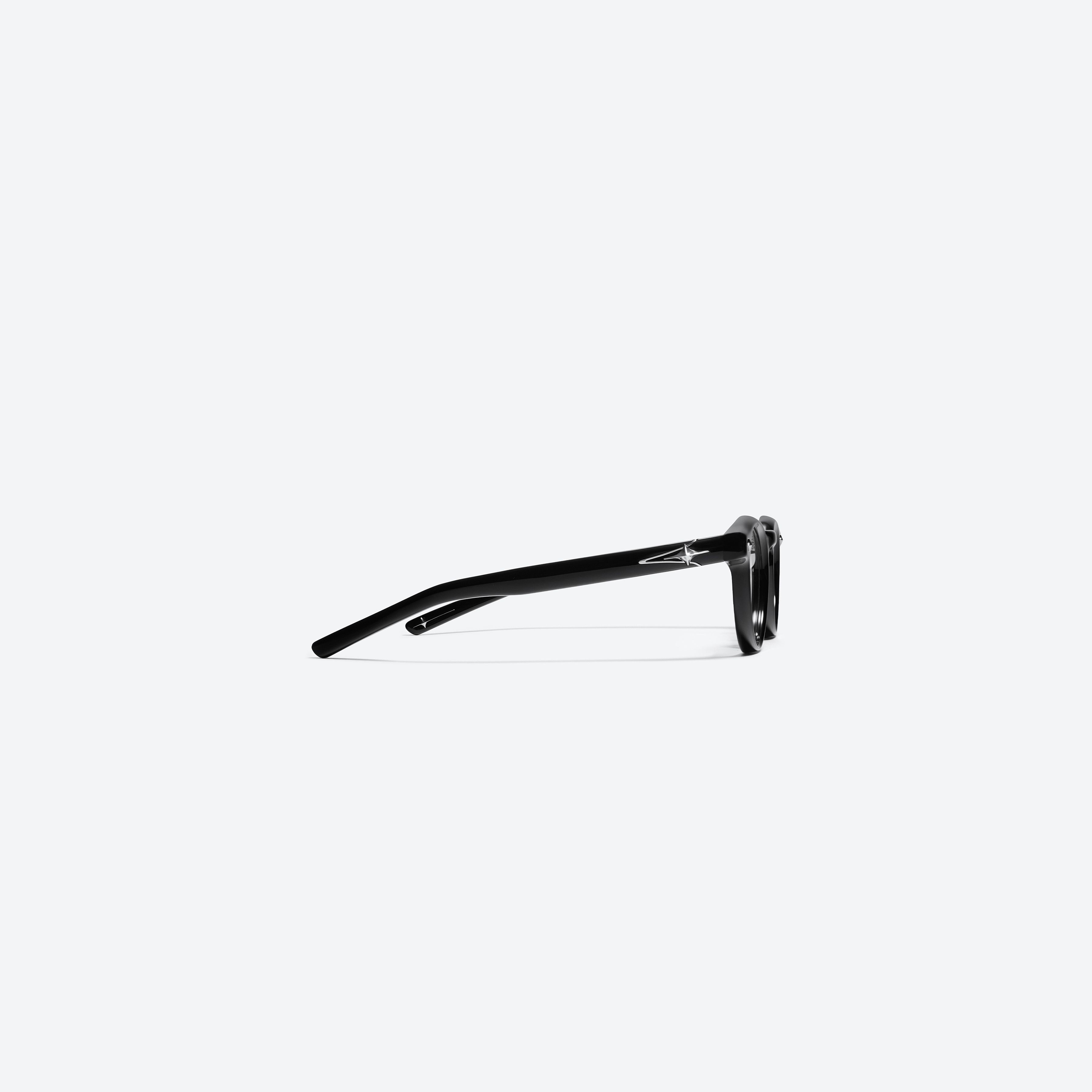 A detailed right view of Gentle Monster Ron 01 Black Acetate framed Round glasses.