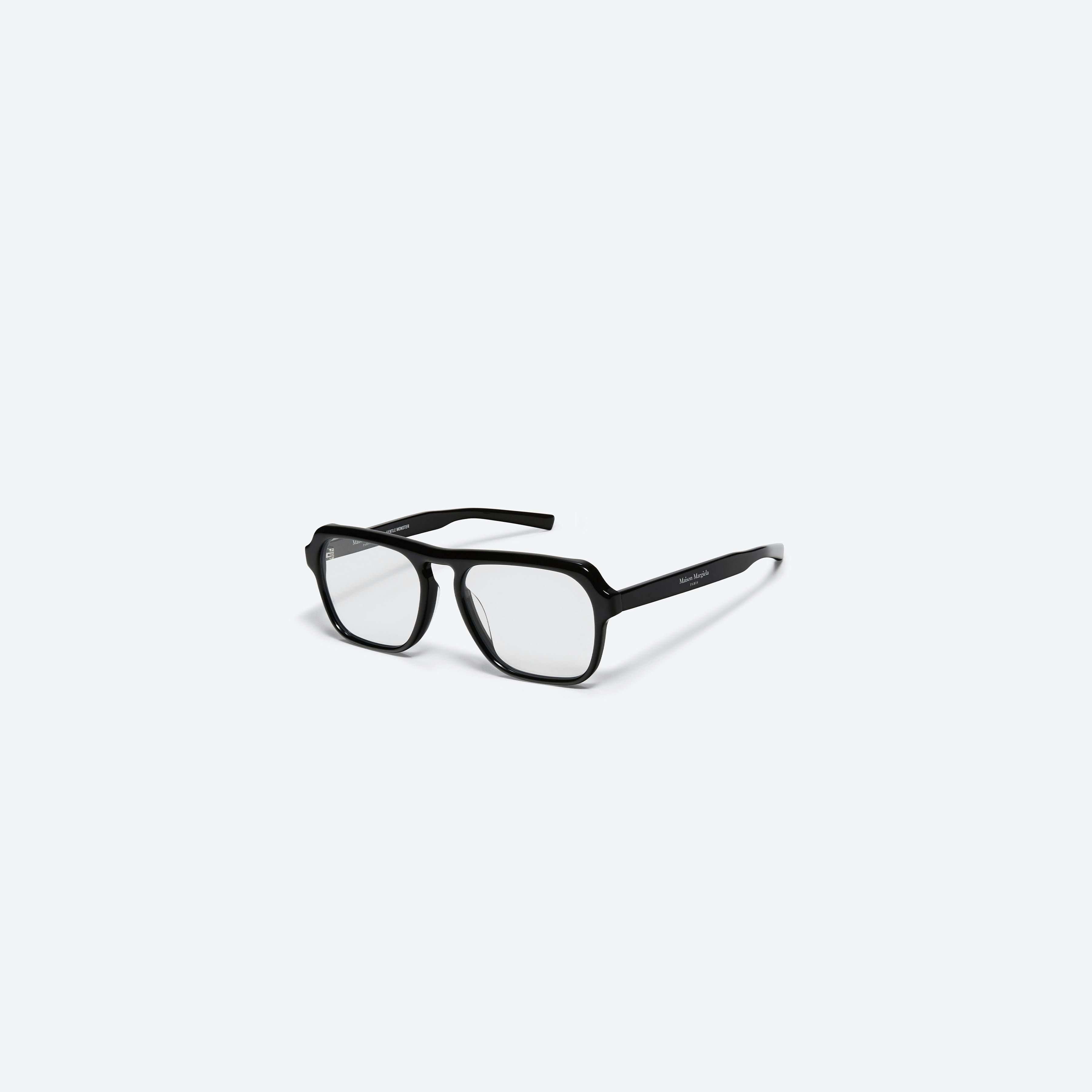 45-degree view of Gentle Monster Maison Margiela - MM011 01 Black Acetate framed Aviator glasses.