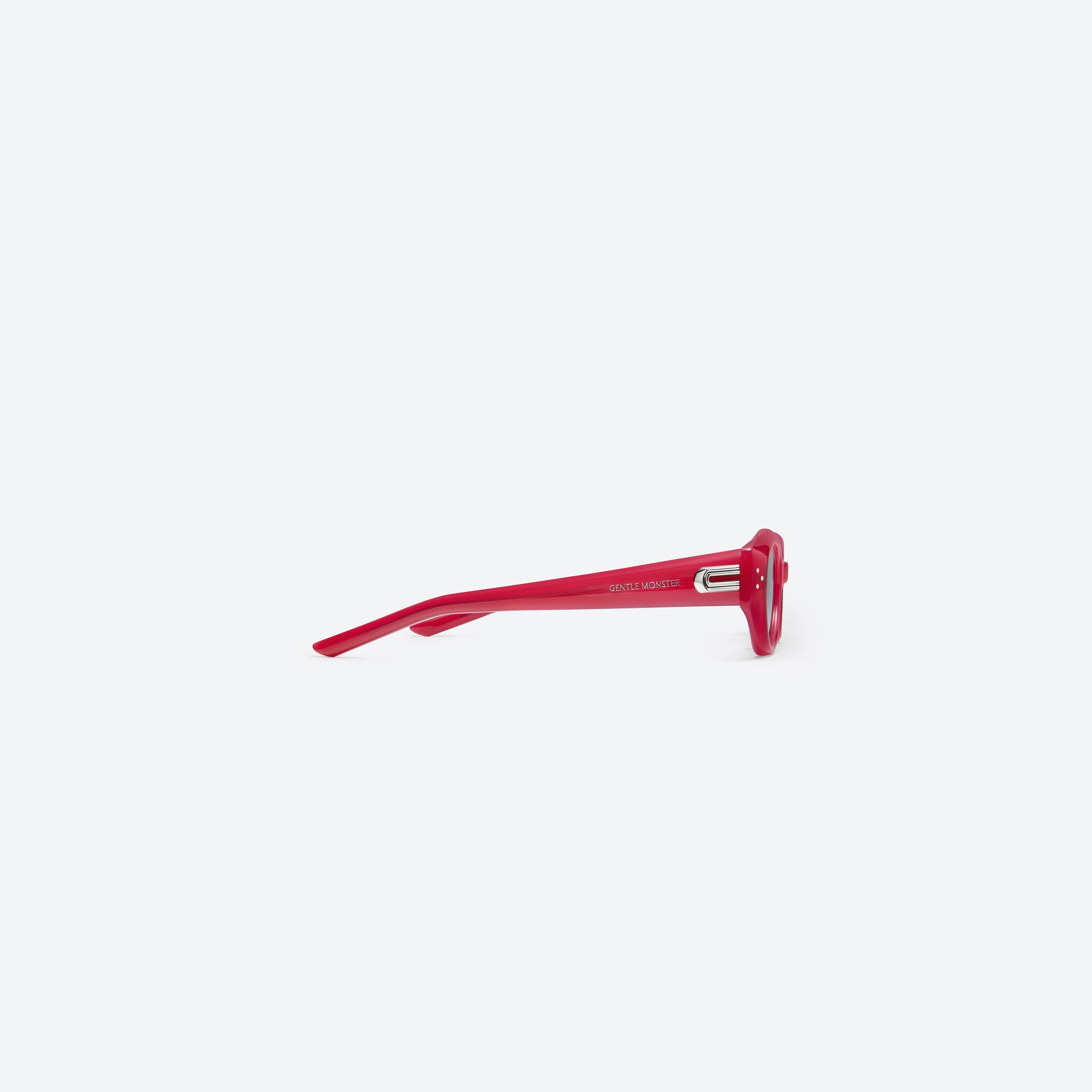 A detailed right view of Gentle Monster Dada RC6 Red Acetate framed Oval sunglasses.