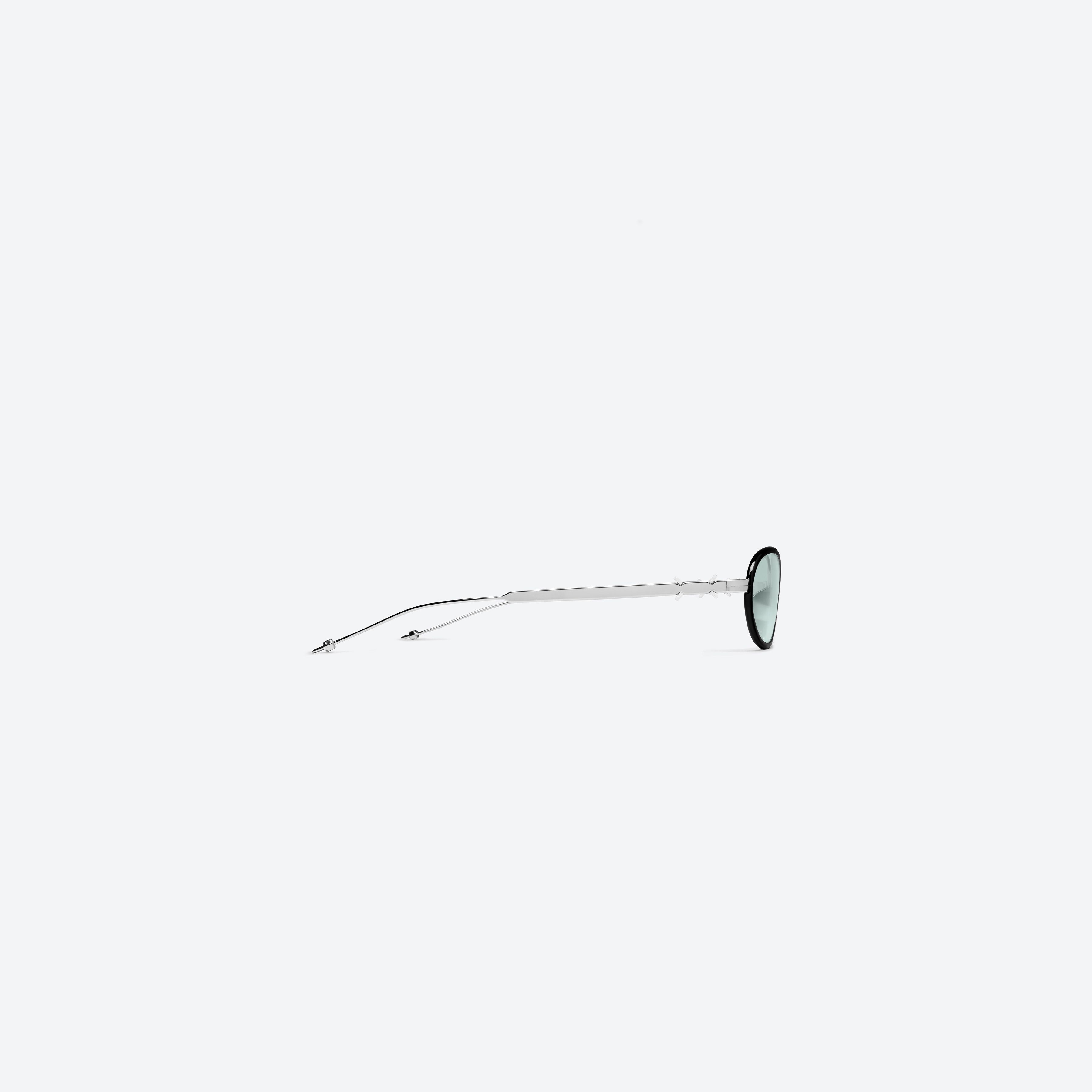 A detailed right view of Gentle Monster Maison Margiela - MM318 01 Black Metal framed Oval sunglasses.