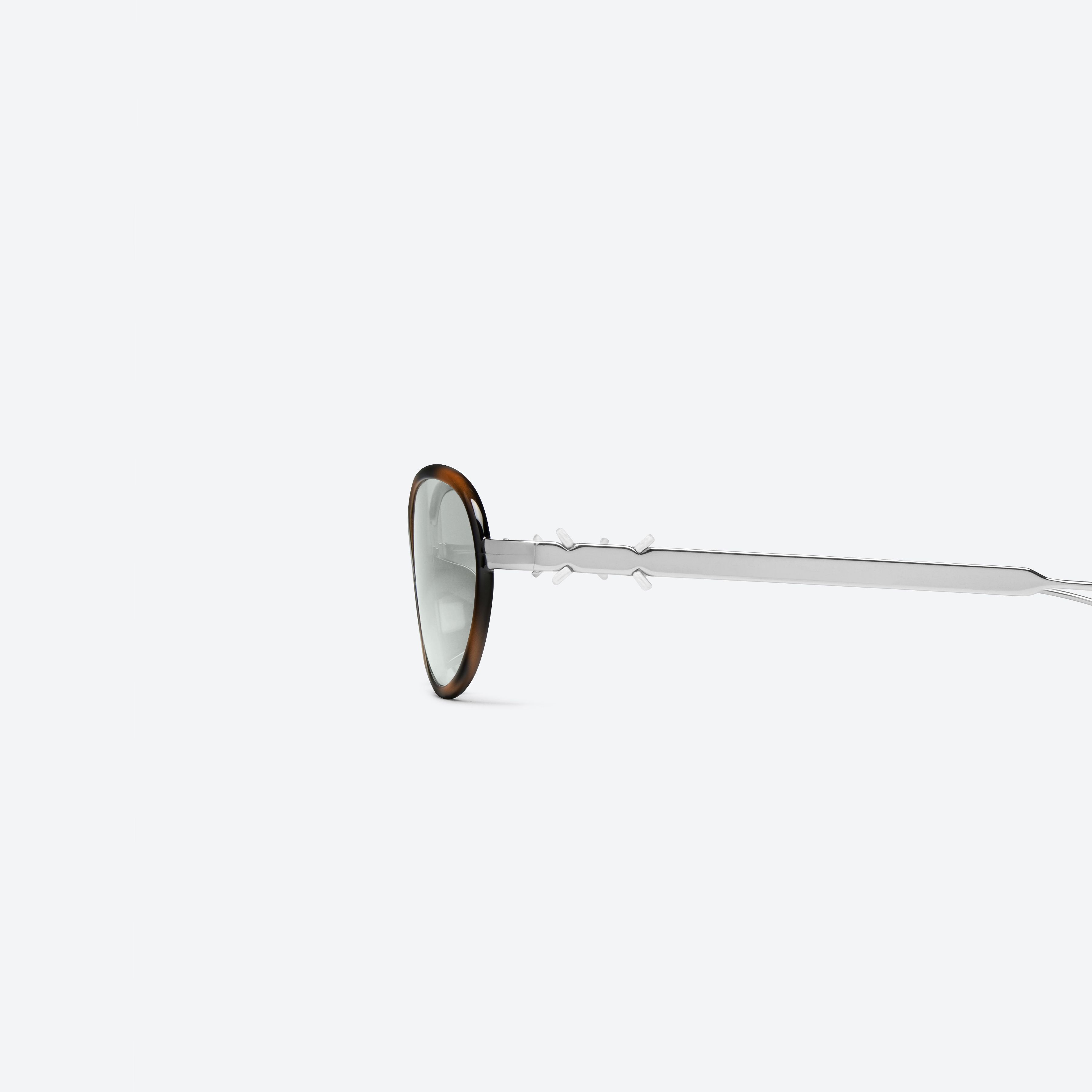 A detailed left view of Gentle Monster Maison Margiela - MM318 L2 Brown Metal framed Oval sunglasses.