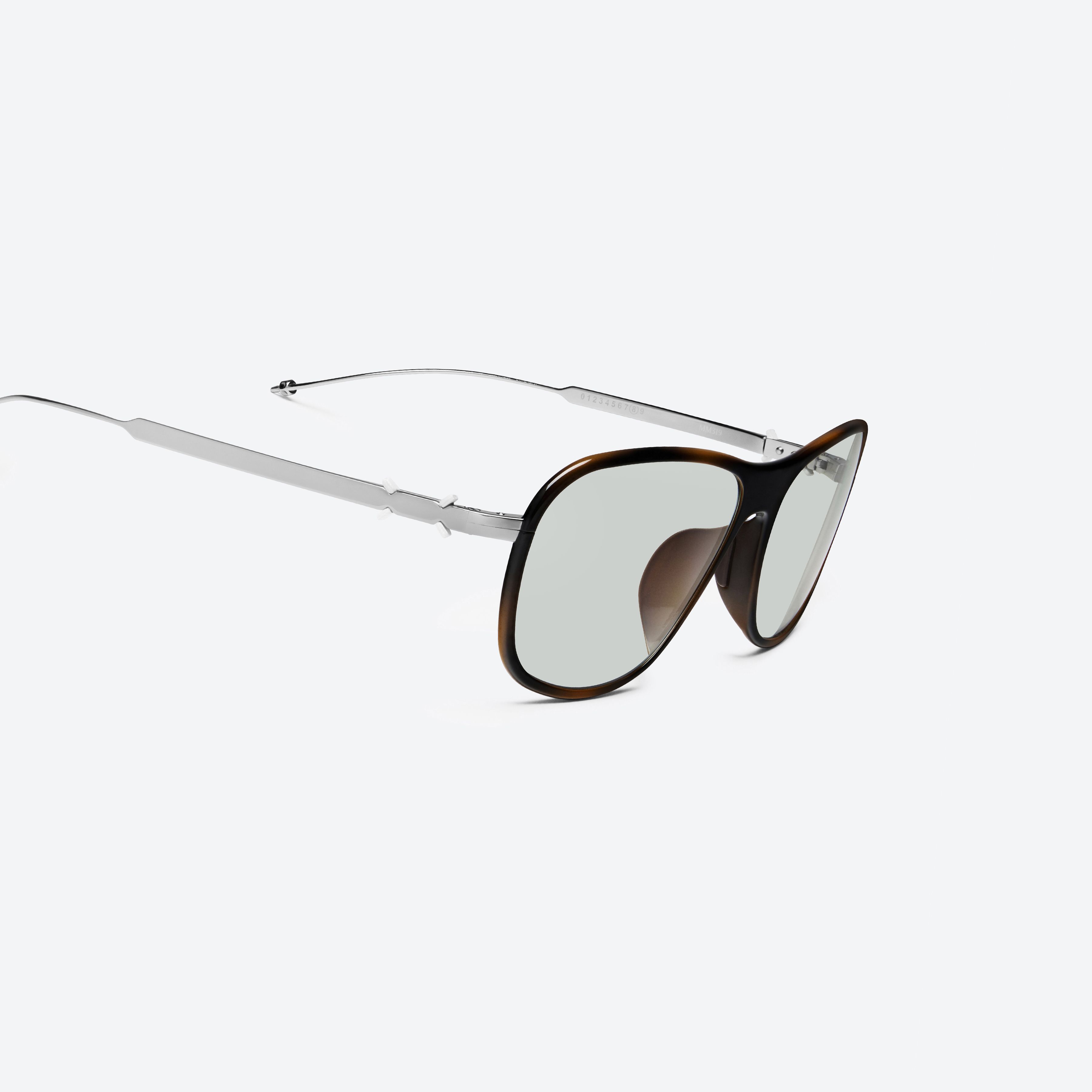 45-degree detailed view of Gentle Monster Maison Margiela - MM319 L2 Brown Metal framed Aviator sunglasses.