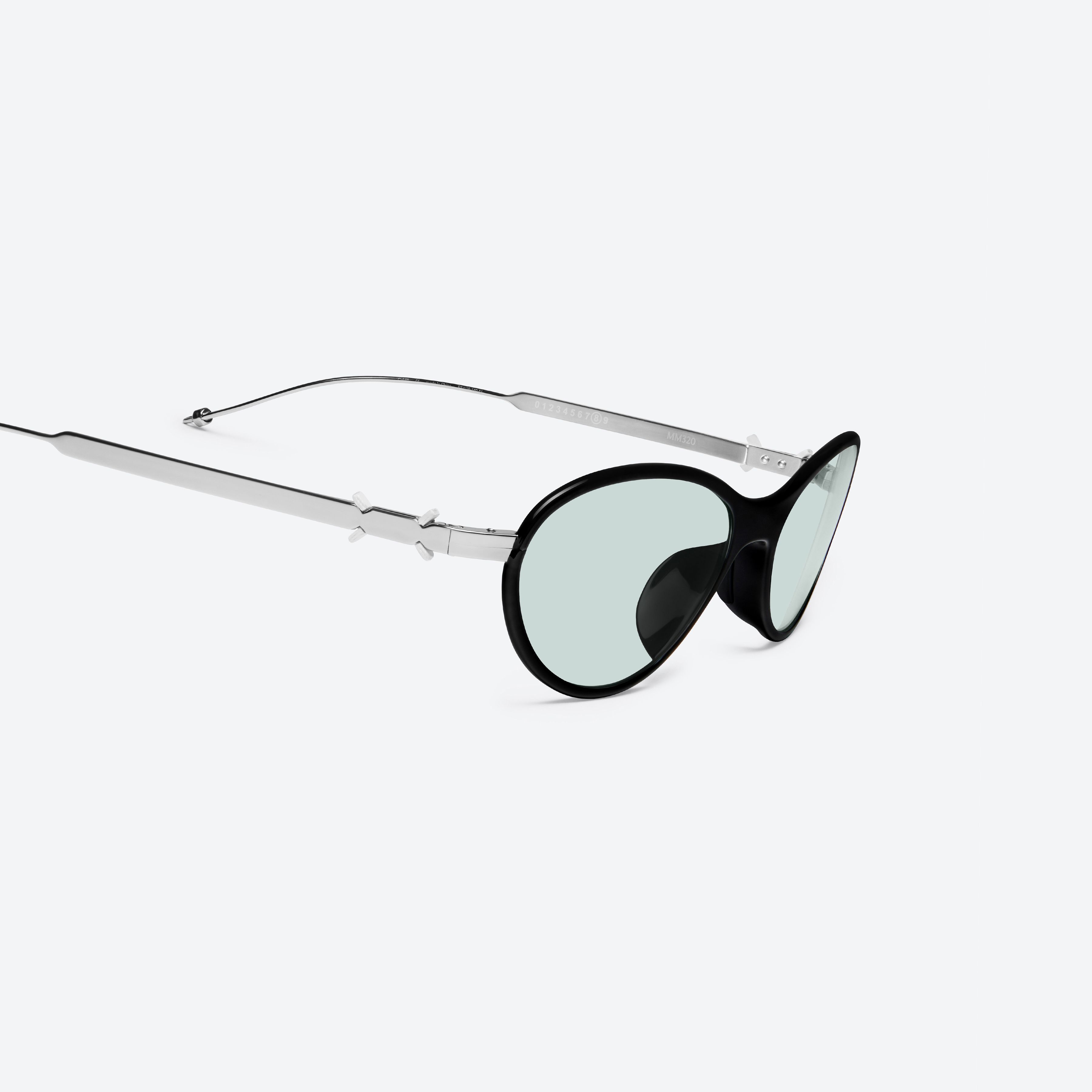 45-degree detailed view of Gentle Monster Maison Margiela - MM320 01 Black Metal framed Aviator sunglasses.