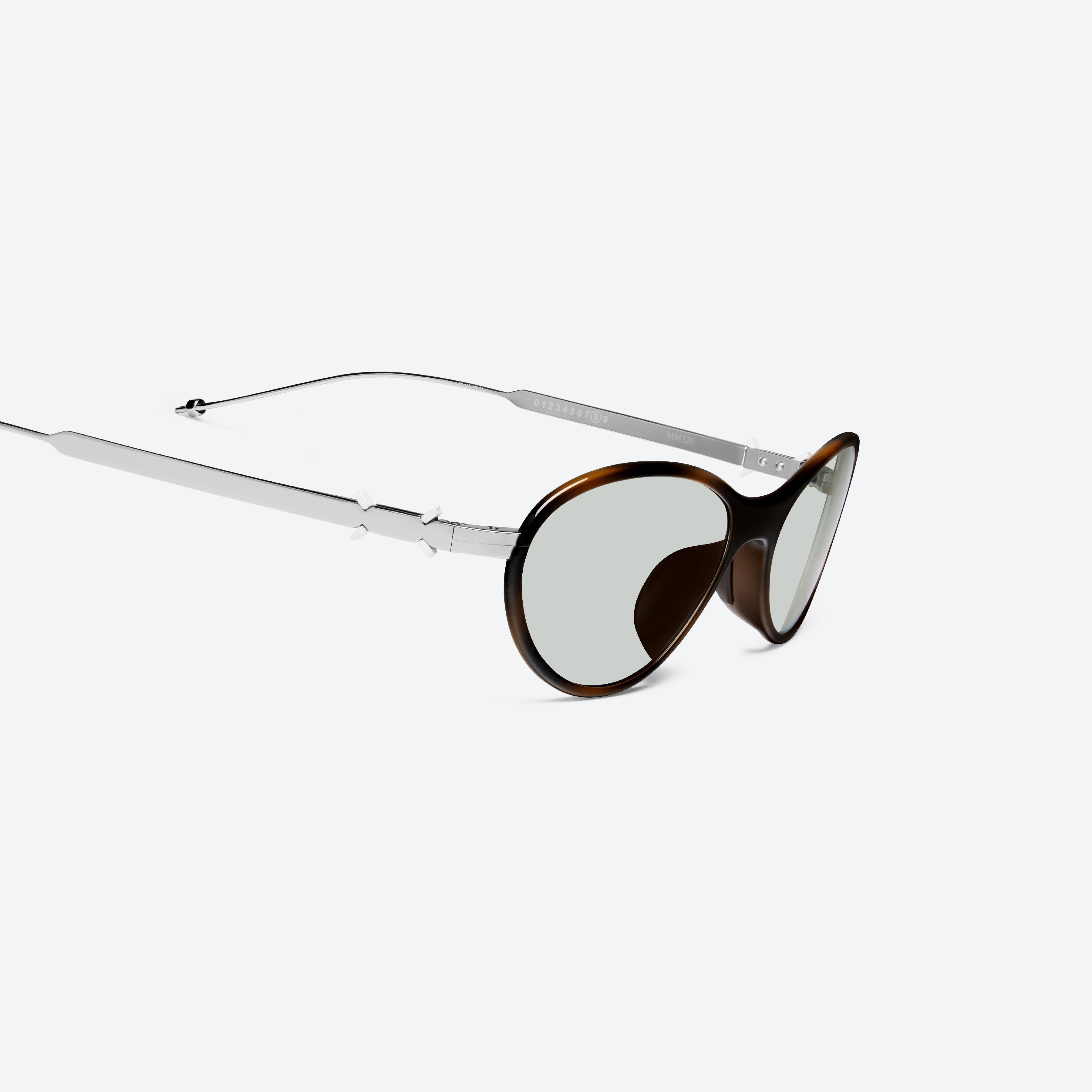45-degree detailed view of Gentle Monster Maison Margiela - MM320 L2 Brown Metal framed Aviator sunglasses.