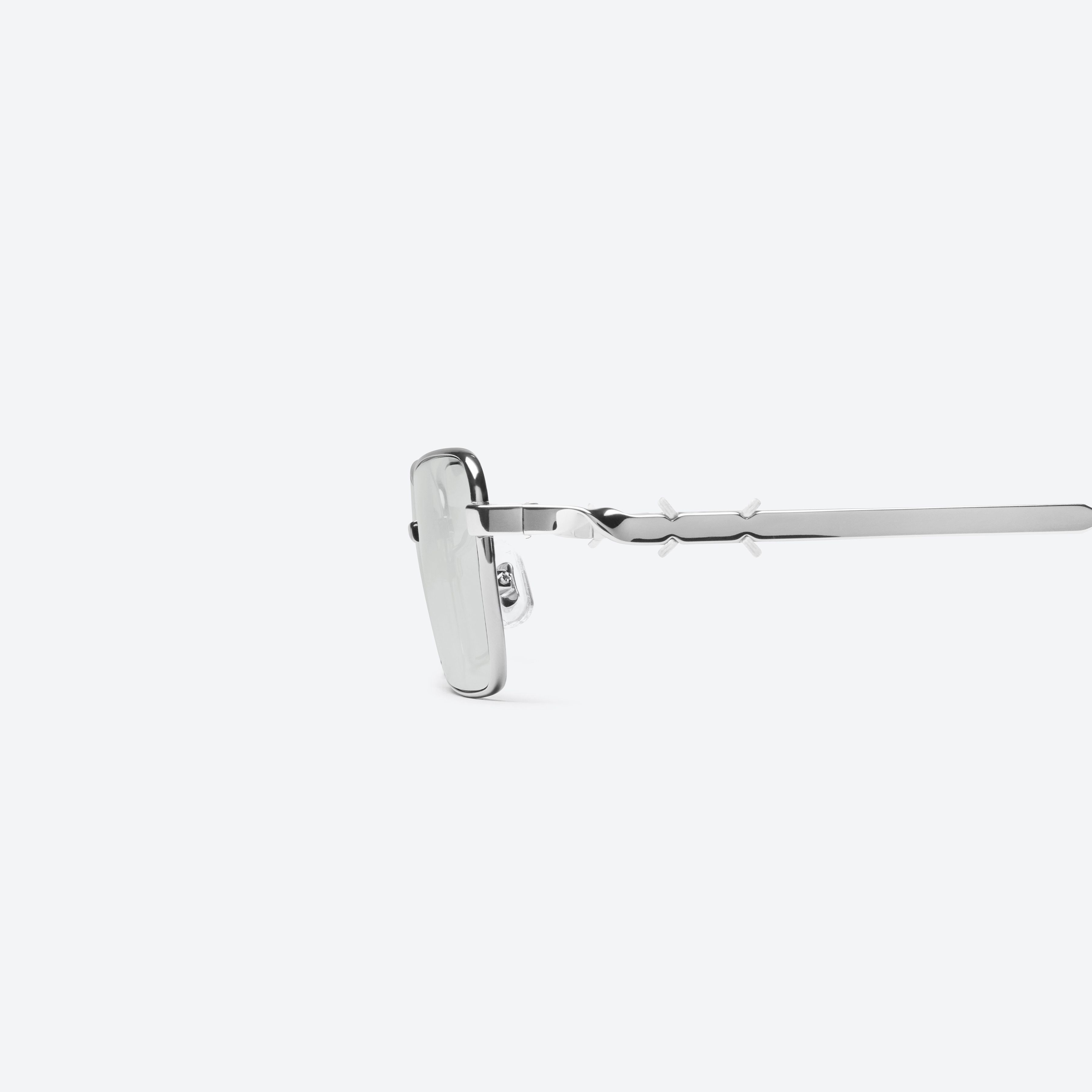 A detailed left view of Gentle Monster Maison Margiela - MM302 02 Silver Metal framed Square sunglasses.
