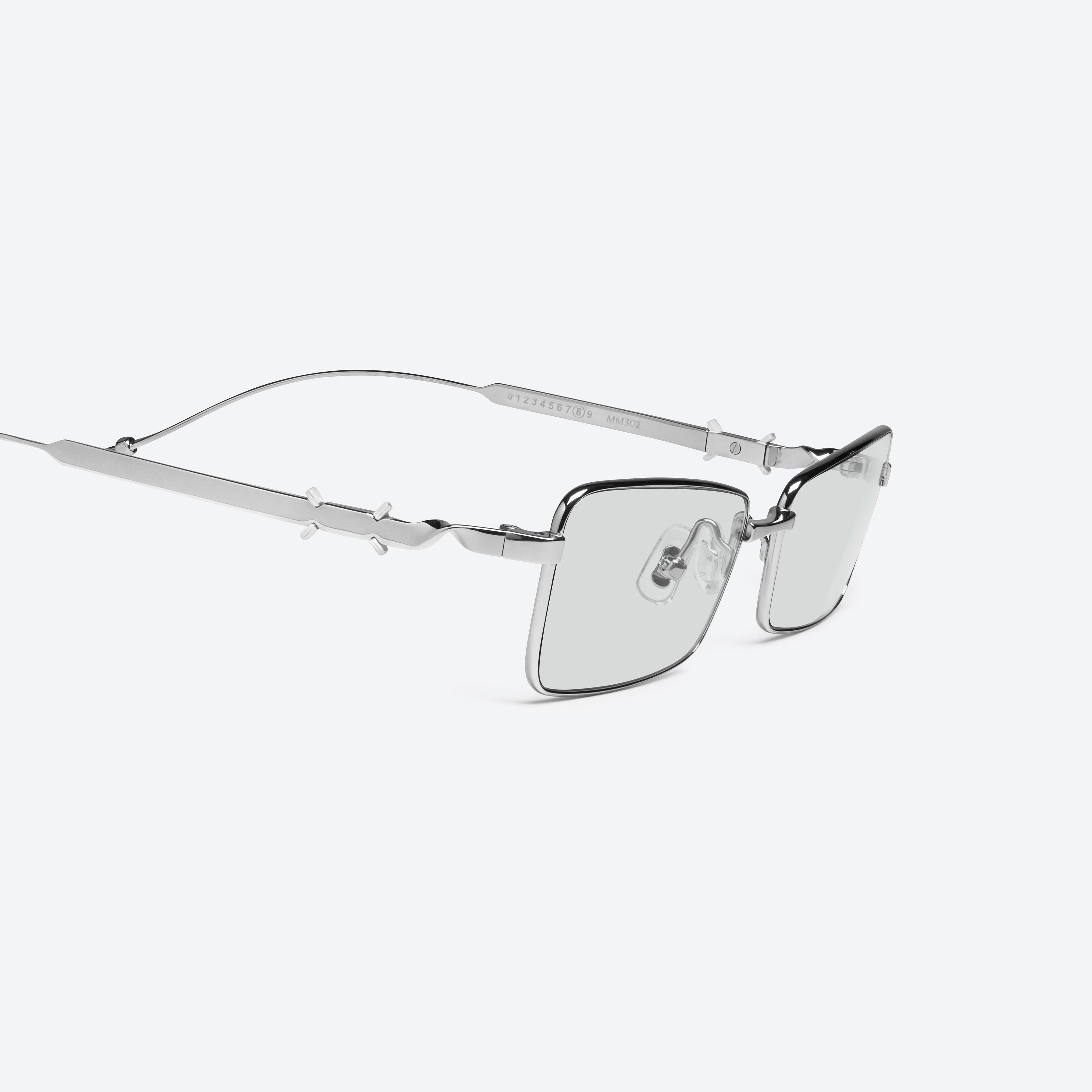 45-degree detailed view of Gentle Monster Maison Margiela - MM302 02 Silver Metal framed Square sunglasses.